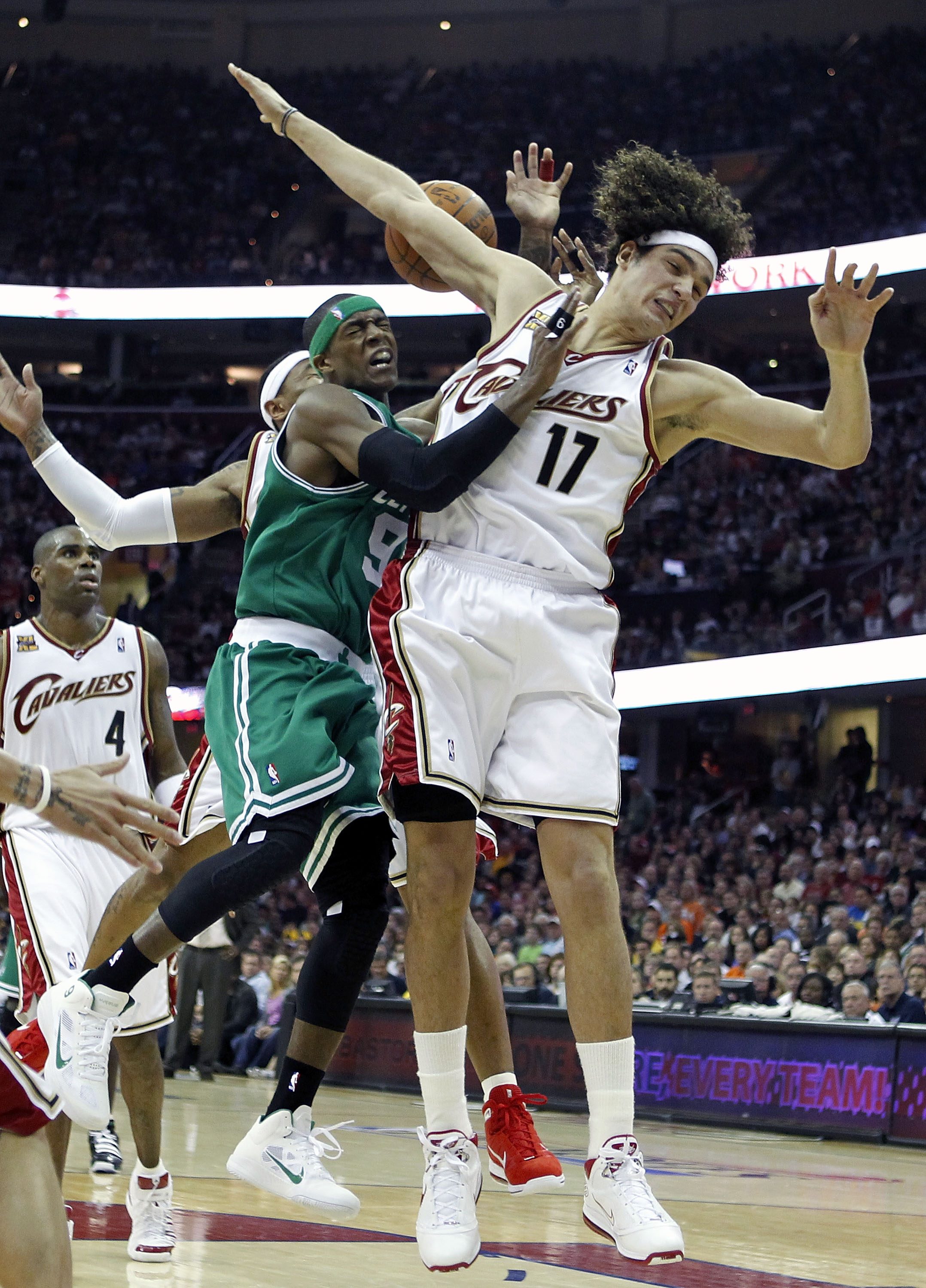 CLEVELAND - MAY 01:  Rajon Rondo #9 of the Boston Celtics tries to get a shot off between Mo Williams #2 and Anderson Varejao #17 of the Cleveland Cavaliers in Game One of the Eastern Conference Semifinals during the 2010 NBA Playoffs at Quicken Loans Are