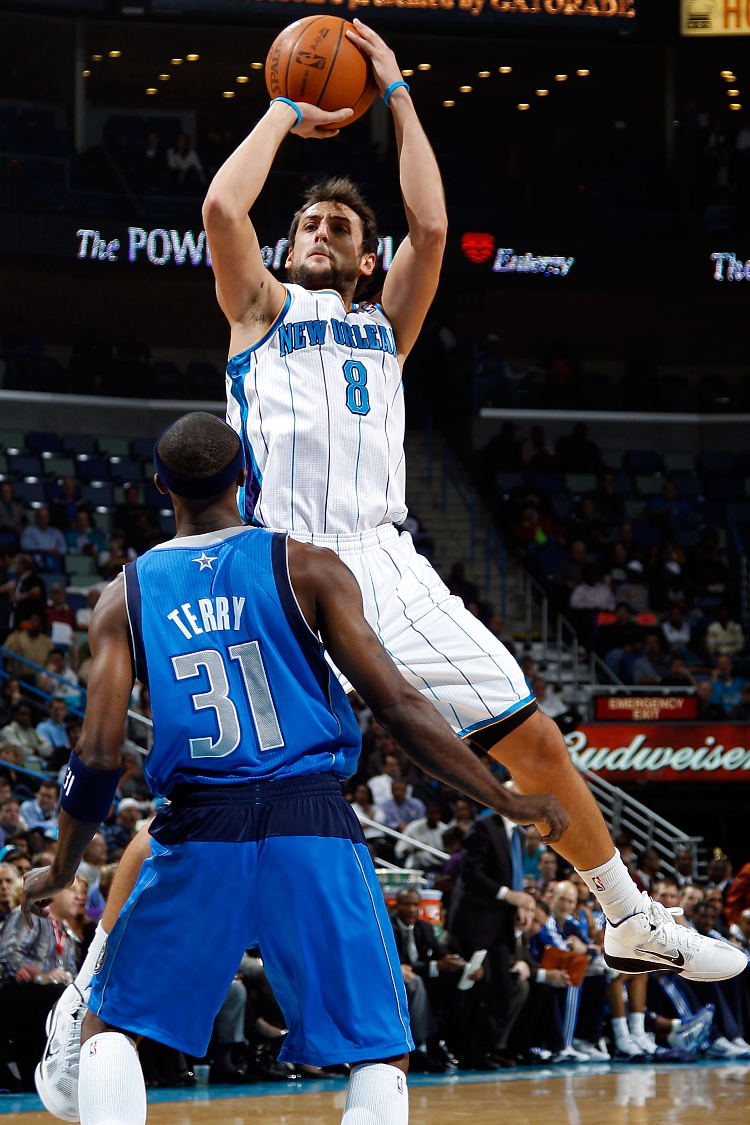 NEW ORLEANS - NOVEMBER 17:  Marco Belinelli #8 of the New Orleans Hornets shoots the ball over Jason Terry #31 of the Dallas Mavericks at the New Orleans Arena on November 17, 2010 in New Orleans, Louisiana.  NOTE TO USER: User expressly acknowledges and