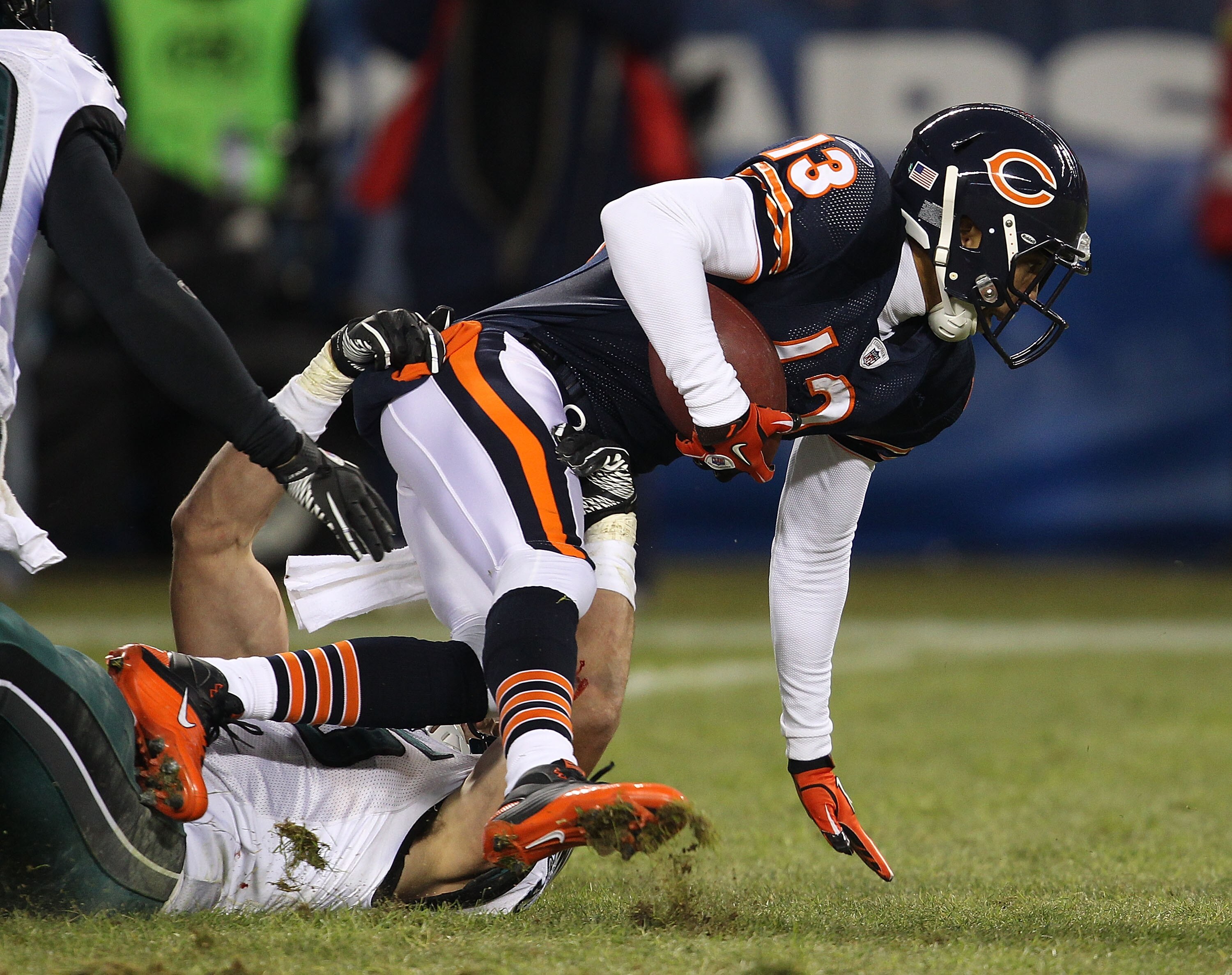 CHICAGO - NOVEMBER 28: Johnny Knox #13 of the Chicago Bears is tackled by Stewart Bradley #55 of the Philadelphia Eagles at Soldier Field on November 28, 2010 in Chicago, Illinois. The Bears defeated the Eagles 31-26. (Photo by Jonathan Daniel/Getty Image