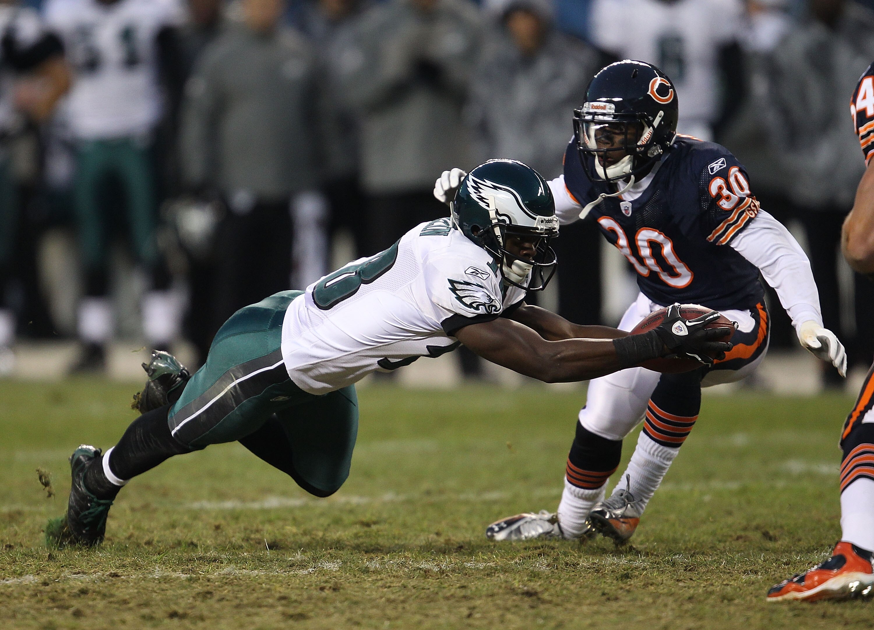CHICAGO - NOVEMBER 28: Jeremy Maclin #18 of the Philadelphia Eagles reaches for a first down in front of D.J. Moore #30 of the Chicago Bears at Soldier Field on November 28, 2010 in Chicago, Illinois. The Bears defeated the Eagles 31-26. (Photo by Jonatha