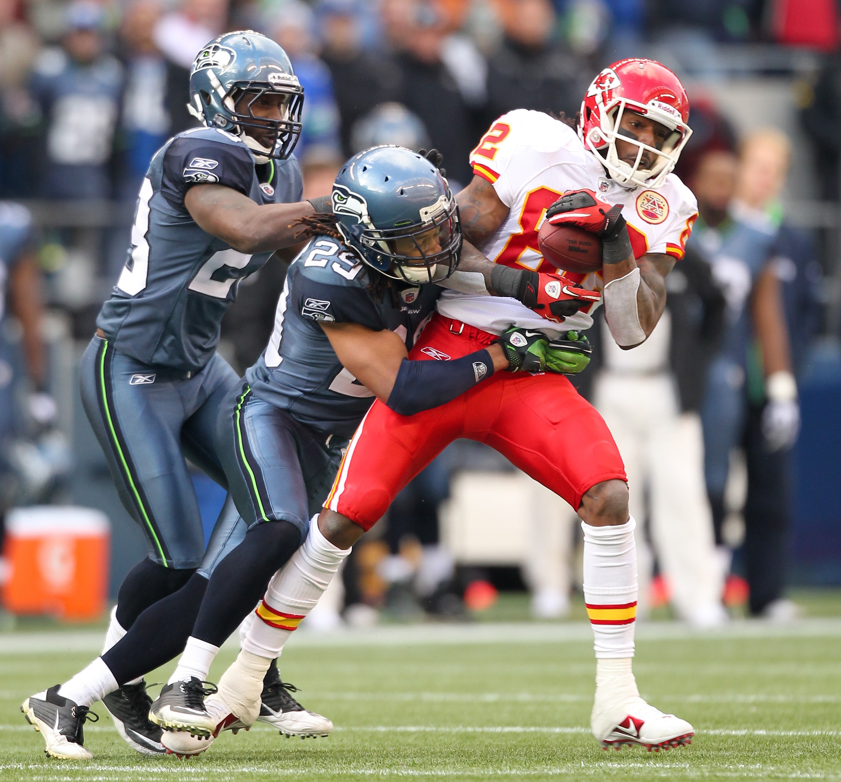 SEATTLE, WA - NOVEMBER 28:  Wide receiver Dwayne Bowe #82 of the Kansas City Chiefs rushes against Earl Thomas #29 and Marcus Trufant #23 of the Seattle Seahawks at Qwest Field on November 28, 2010 in Seattle, Washington. The Chiefs defeated the Seahawks 