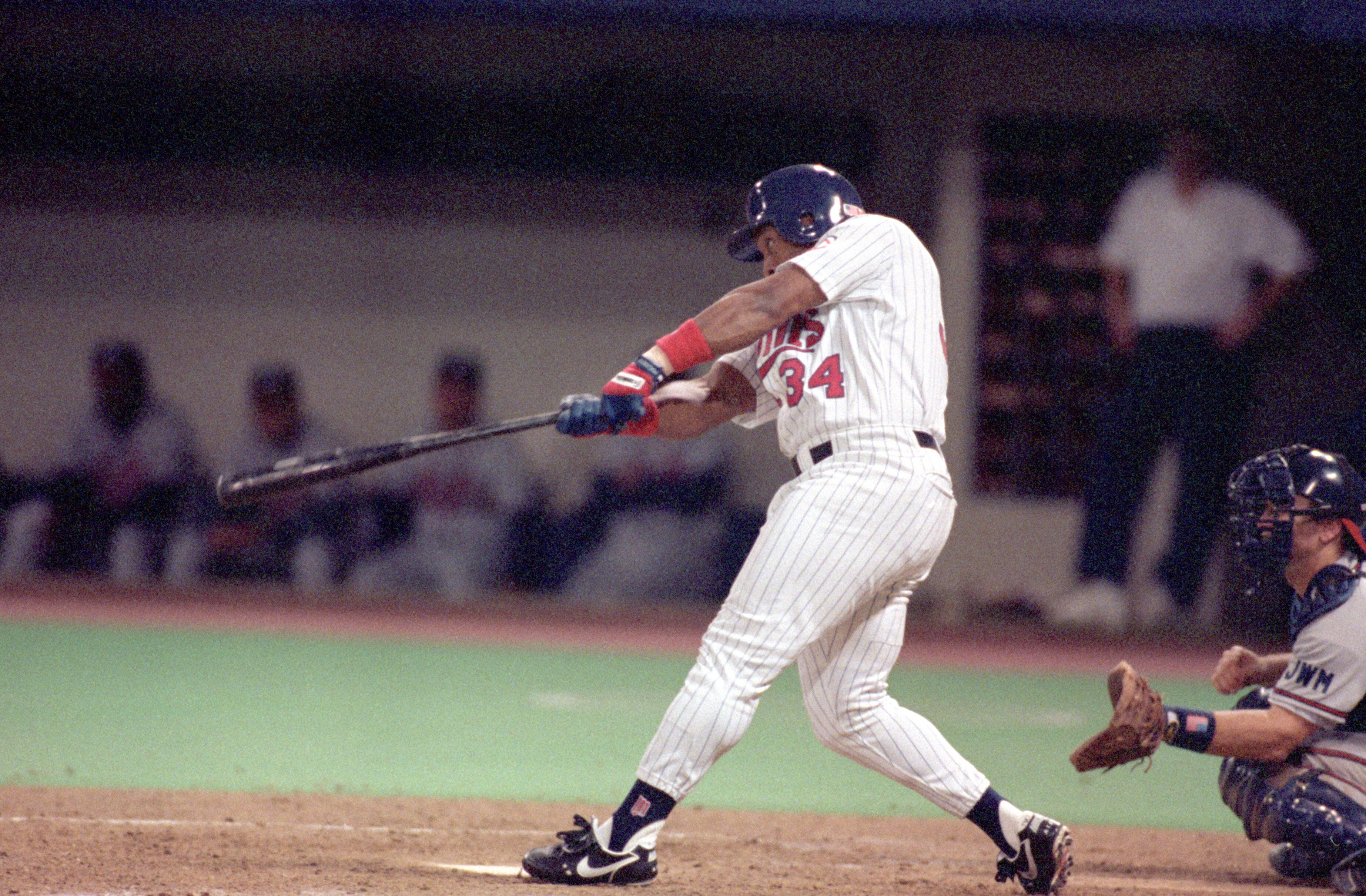 MINNEAPOLIS - OCTOBER 19:  Kirby Puckett #34 of the Minnesota Twins swings at a pitch during Game one of the 1991 World Series against the Atlanta Braves at the Metrodome on October 19, 1991 in Minneapolis, Minnesota. The Twins defeated the Braves 5-2.  (