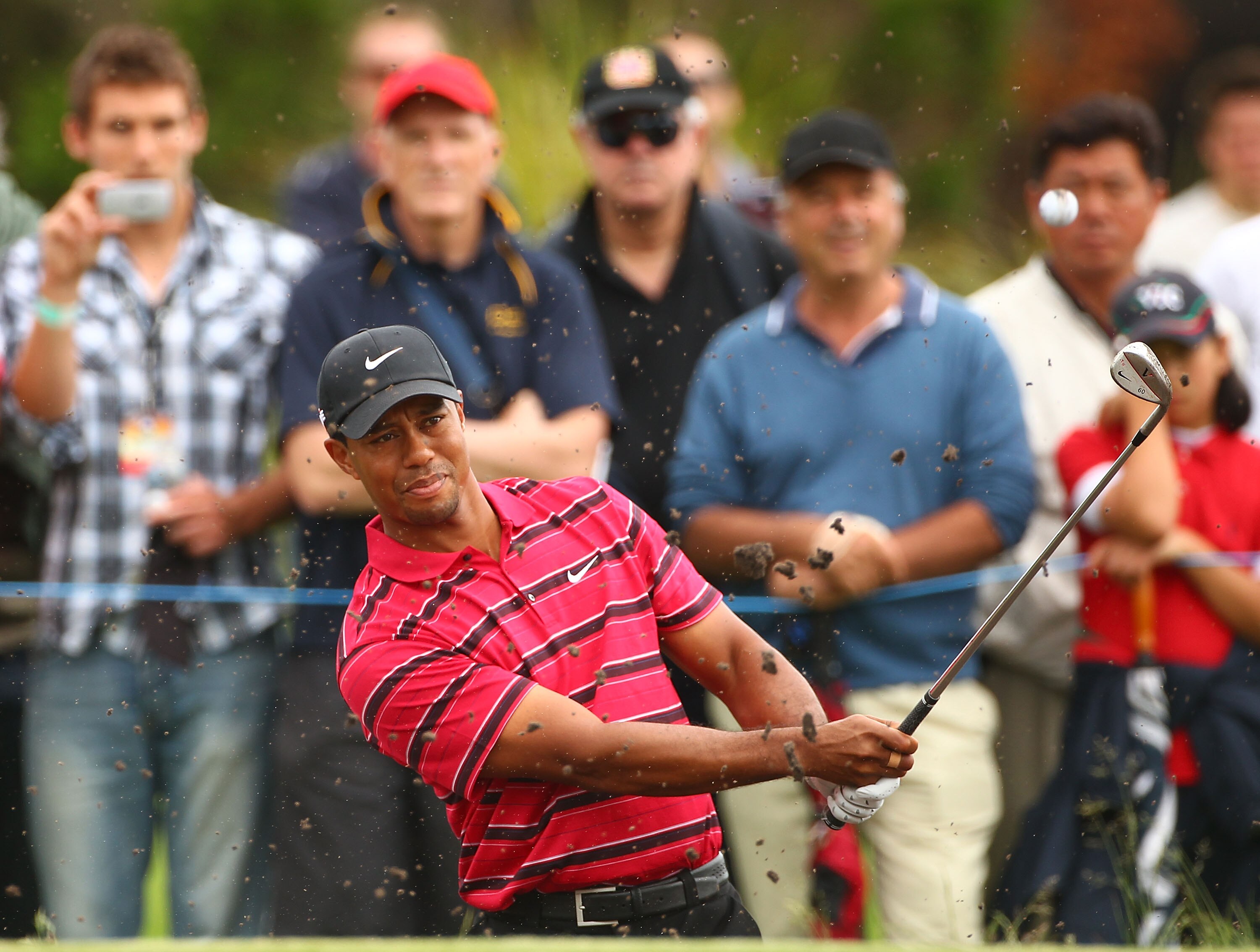 MELBOURNE, AUSTRALIA - NOVEMBER 14:  Tiger Woods of the USA hits his shot out of the bunker during day four of the Australian Masters at The Victoria Golf Club on November 14, 2010 in Melbourne, Australia.  (Photo by Robert Cianflone/Getty Images)