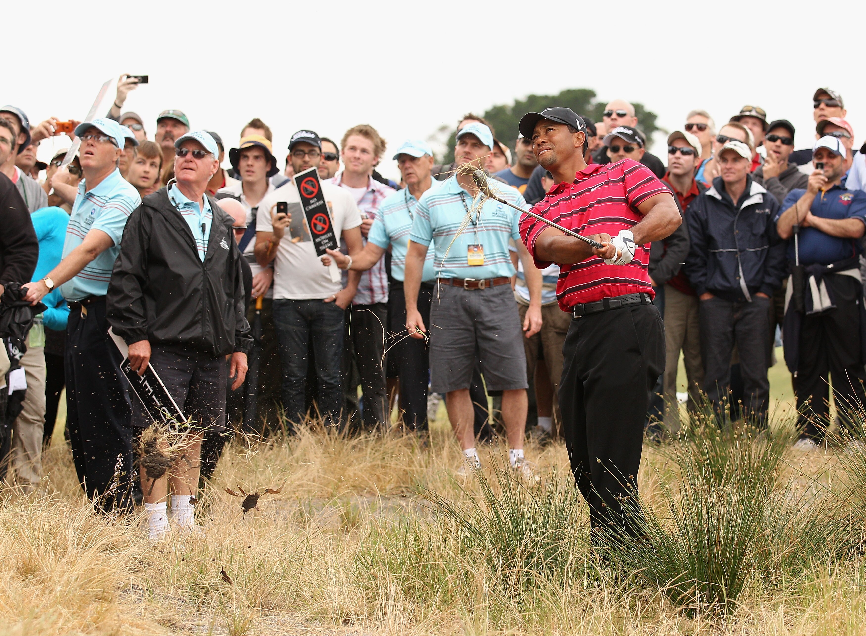 MELBOURNE, AUSTRALIA - NOVEMBER 14:  Tiger Woods of the USA plays out of the rough during round four of the Australian Masters at The Victoria Golf Club on November 14, 2010 in Melbourne, Australia.  (Photo by Ryan Pierse/Getty Images)