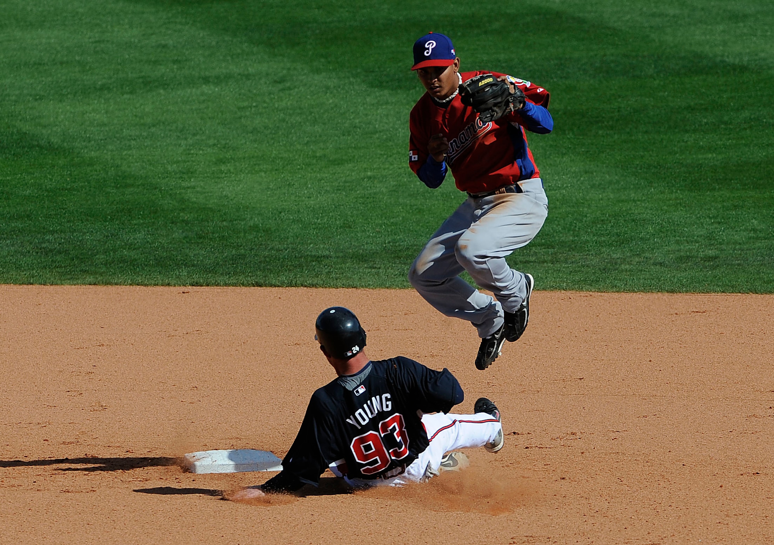 KISSIMMEE, FL - MARCH 03:  Matt Young #93 of the Atlanta Braves slides in to 2nd base against Kevin Ramos #6 of Panama during an exhibition game at Champion Stadium on March 3, 2009 in Kissimmee, Florida.  (Photo by Sam Greenwood/Getty Images)