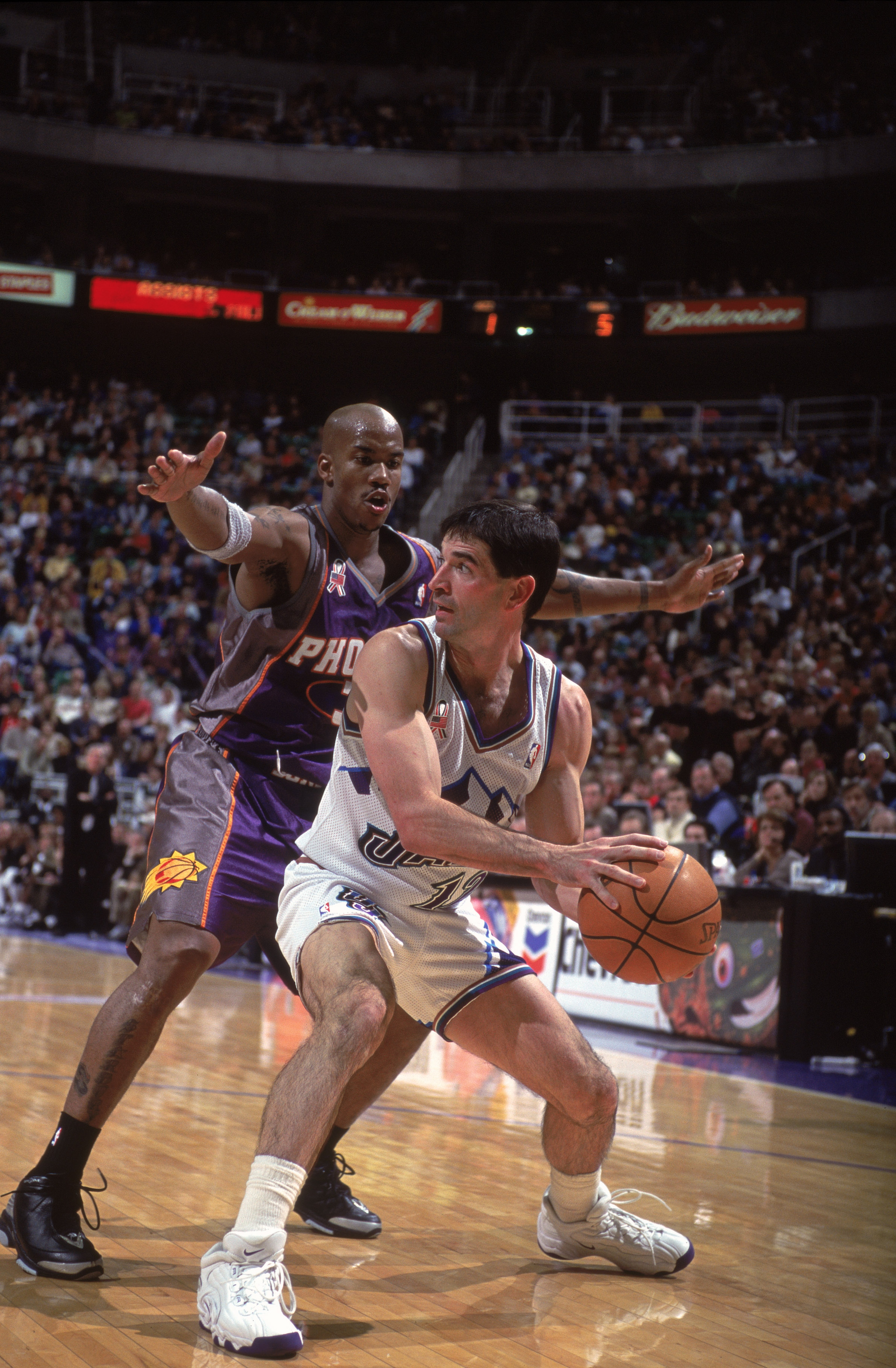 26 Nov 2001:  John Stockton #12  of the Utah Jazz looks to move the ball as he is guarded by Stephon Marbury #3 of the Phoenix Suns during the game at the Delta Center in Salt Lake City, Utah. The Suns defeated the Jazz 111-104. NOTE TO USER: User express