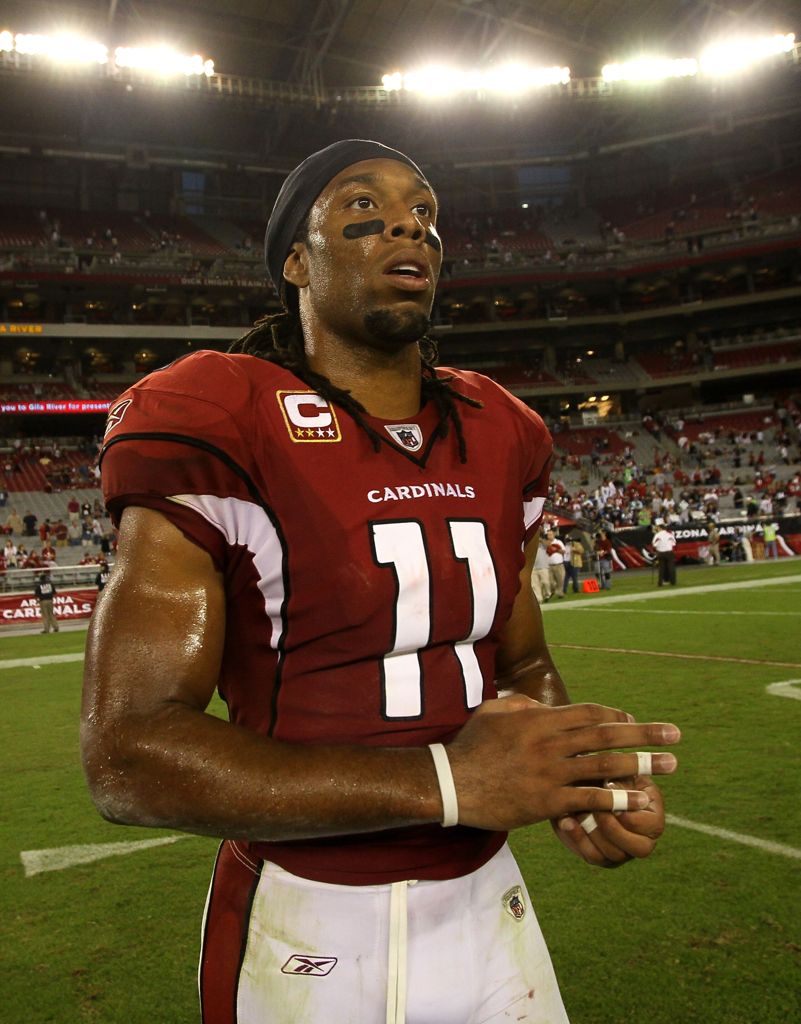 GLENDALE, AZ - NOVEMBER 14: Wide receiver Larry Fitzgerald #11 of the Arizona Cardinals walks off the field after the game with the Seattle Seahawks at University of Phoenix Stadium on November 14, 2010 in Glendale, Arizona. Seattle won 36-18. (Photo by GLENDALE, AZ - NOVEMBER 14: Wide receiver Larry Fitzgerald #11 of the Arizona Cardinals walks off the field after the game with the Seattle Seahawks at University of Phoenix Stadium on November 14, 2010 in Glendale, Arizona. Seattle won 36-18. (Photo by