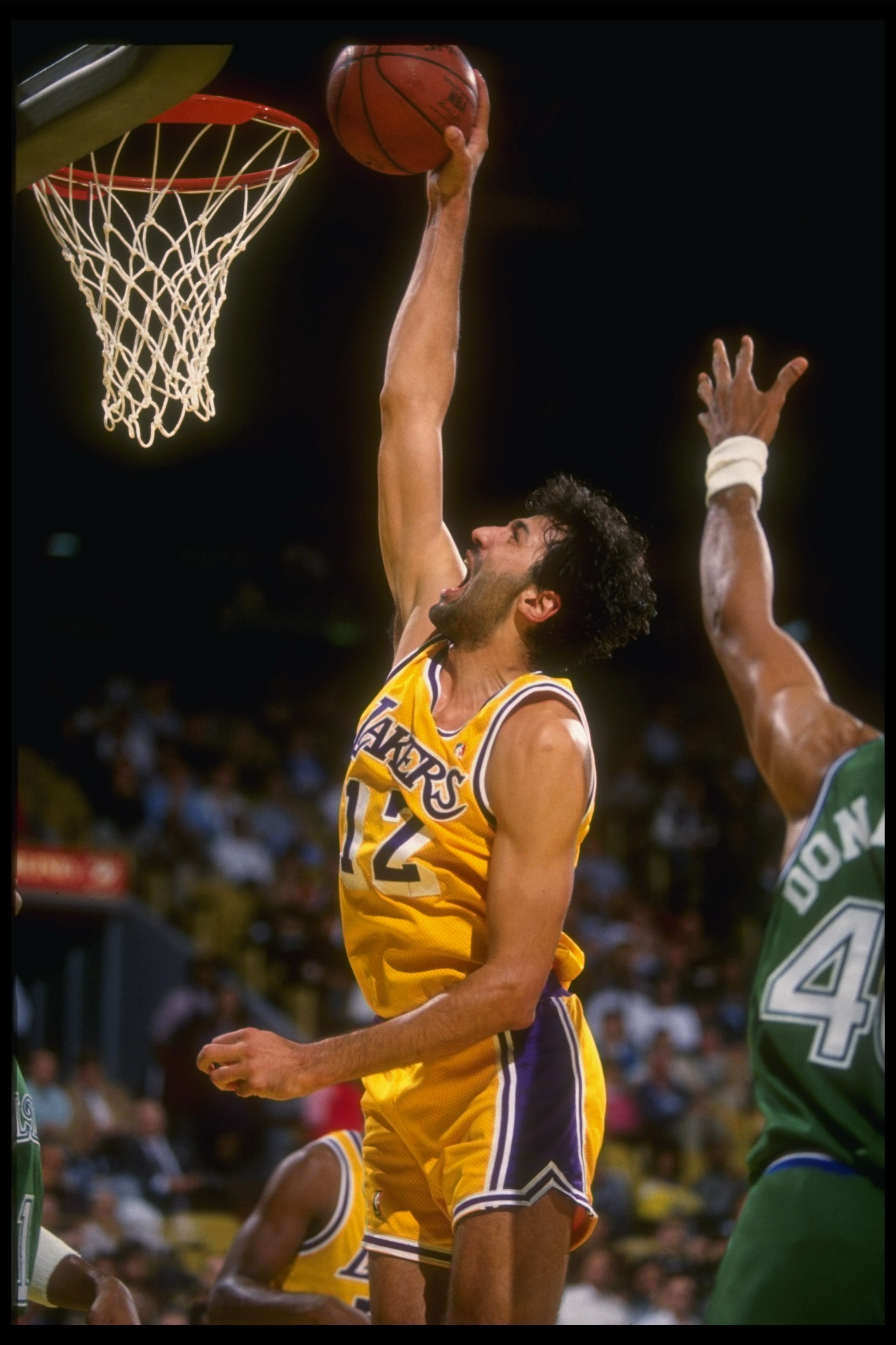 12 Dec 1990:  Center Vlade Divac of the Los Angeles Lakers goes up for two during a game against the Dallas Mavericks at Great Western Forum in Inglewood, California. Mandatory Credit: Mike Powell  /Allsport Mandatory Credit: Mike Powell  /Allsport