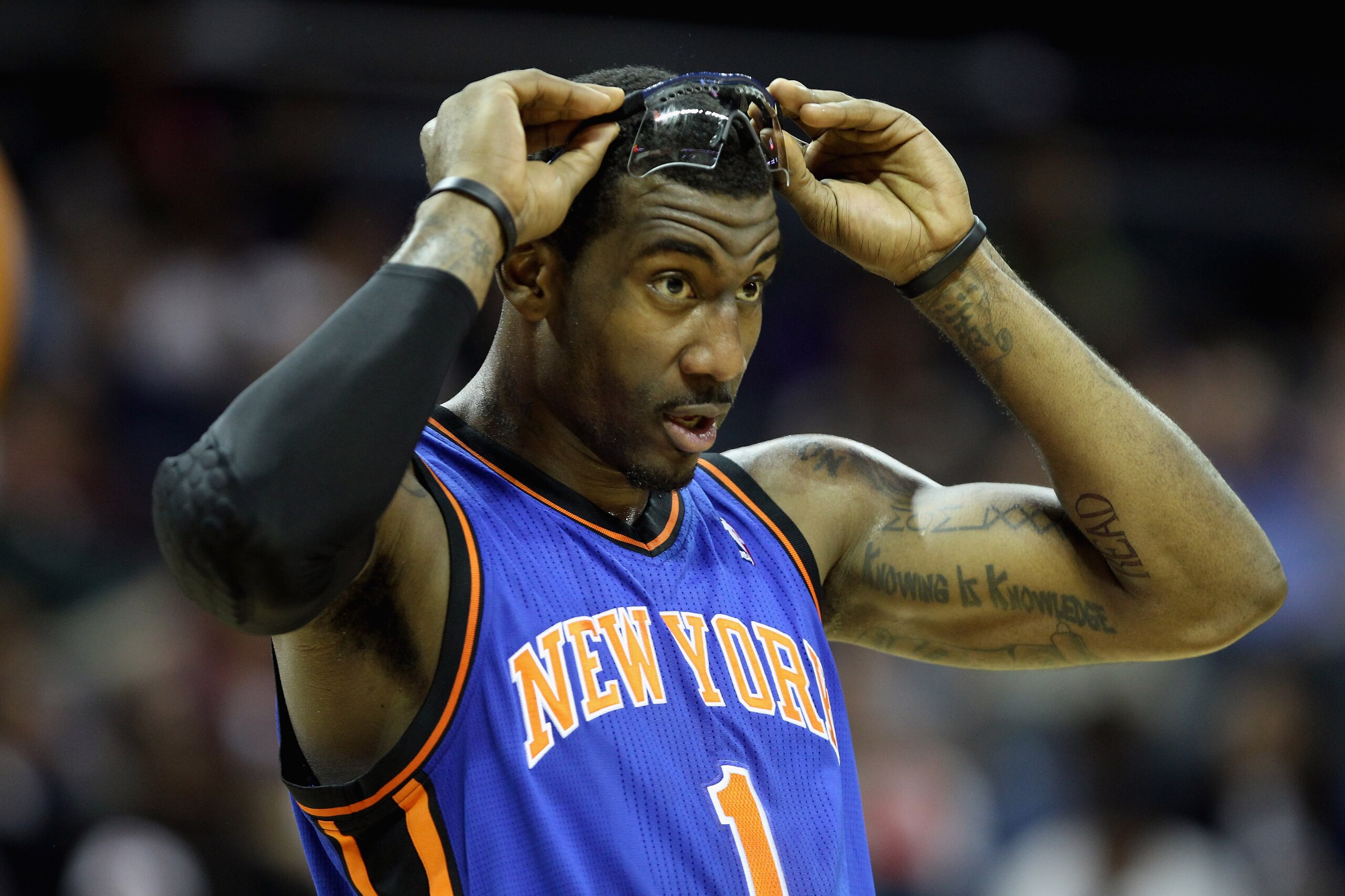 CHARLOTTE, NC - NOVEMBER 24:  Amare Stoudemire #1 of the New York Knicks watches on during his game against the Charlotte Bobcats at Time Warner Cable Arena on November 24, 2010 in Charlotte, North Carolina.  NOTE TO USER: User expressly acknowledges and