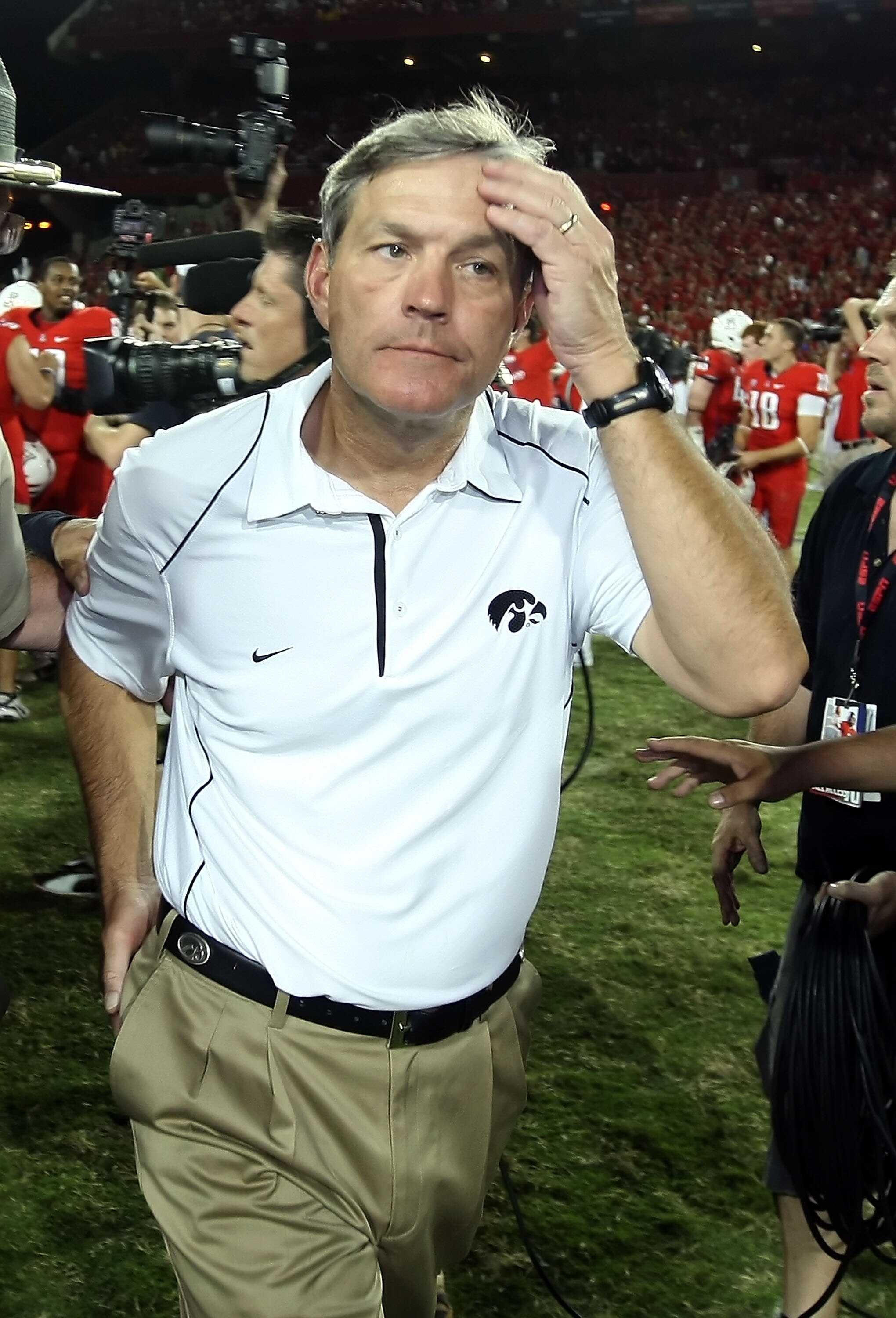 TUCSON, AZ - SEPTEMBER 18:  Head coach Kirk Ferentz of the Iowa Hawkeyes walks off the field after being defeated by the Arizona Wildcats in the college football game at Arizona Stadium on September 18, 2010 in Tucson, Arizona. The Wildcats defeated the H