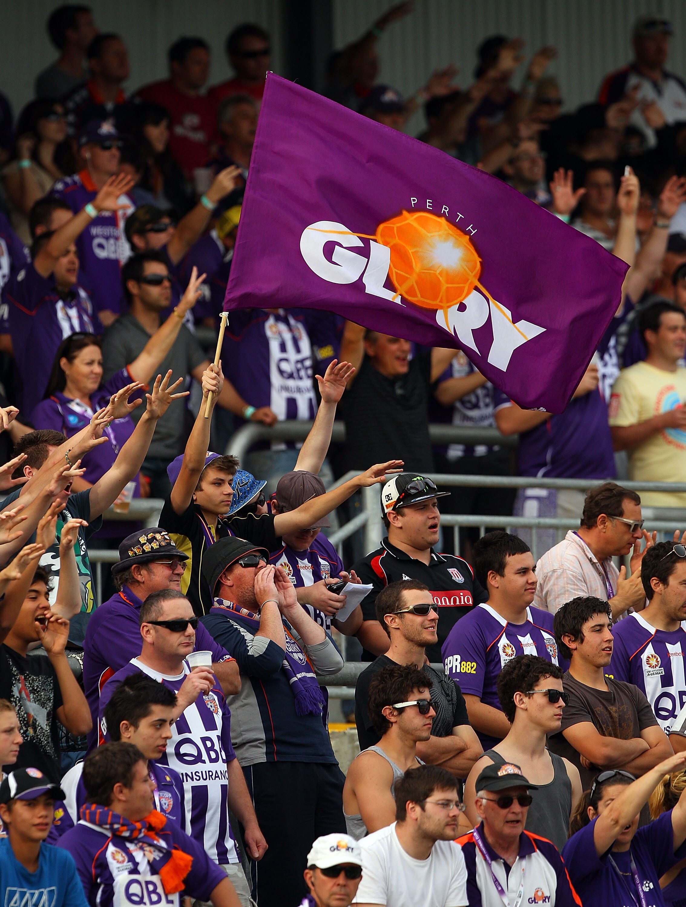 PERTH, AUSTRALIA - NOVEMBER 14:  Glory fans chant during the round 14 A-League match between the Perth Glory and the Melbourne Victory at nib Stadium on November 14, 2010 in Perth, Australia.  (Photo by Paul Kane/Getty Images)