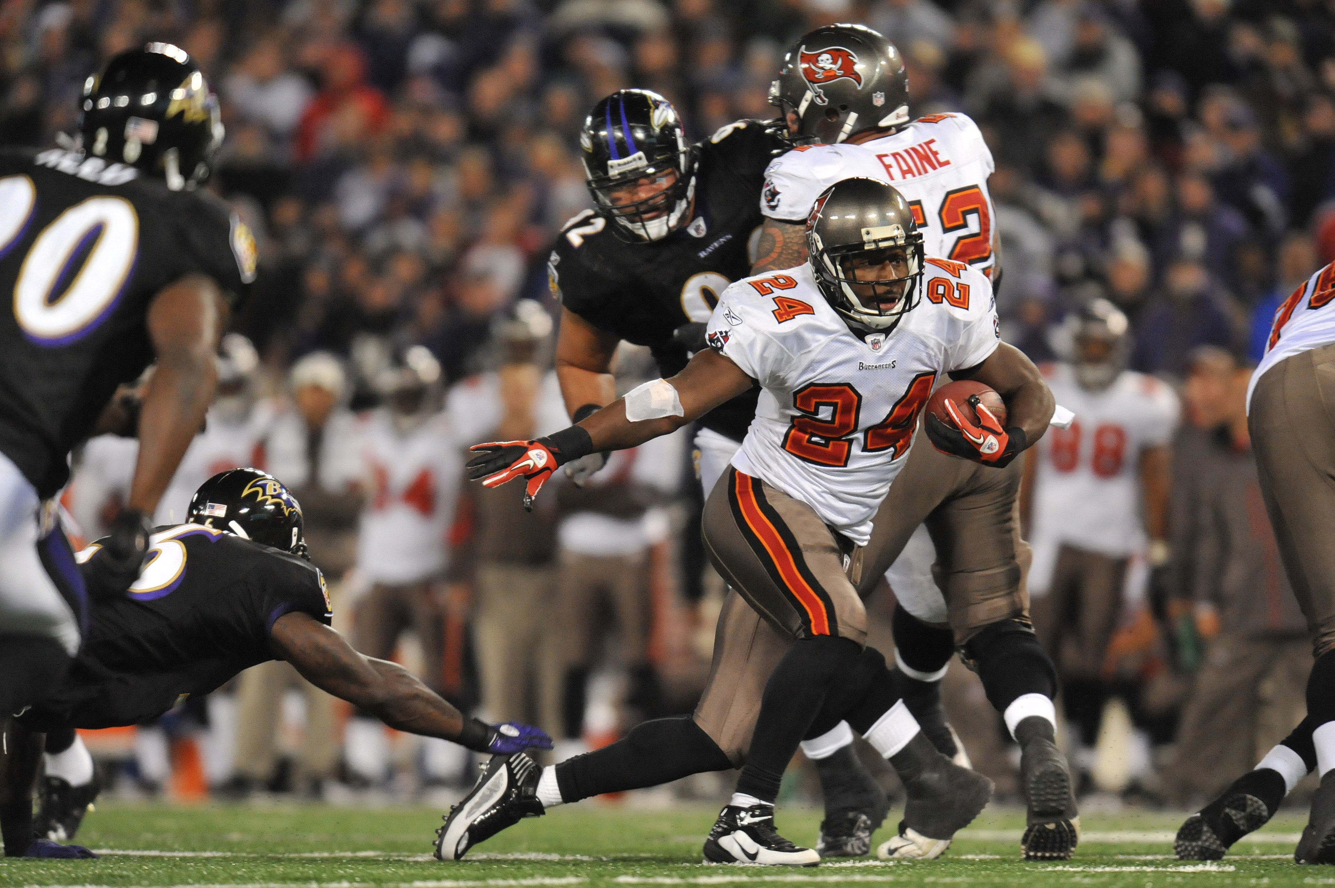BALTIMORE, MD - NOVEMBER 28:  Carnell Williams #24 of the Tampa Bay Buccaneers runs the ball against the Baltimore Ravens at M&T Bank Stadium on November 28, 2010 in Baltimore, Maryland. The Ravens defeated the Buccaneers 17-10. (Photo by Larry French/Get