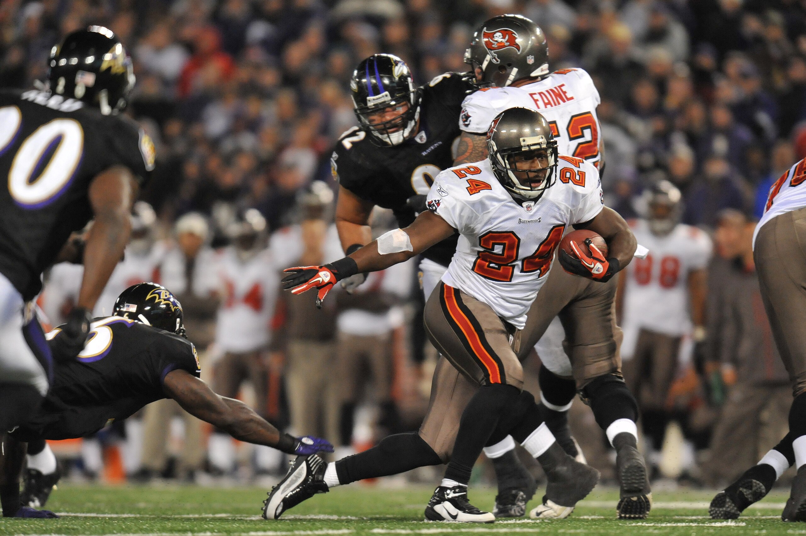 BALTIMORE, MD - NOVEMBER 28:  Carnell Williams #24 of the Tampa Bay Buccaneers runs the ball against the Baltimore Ravens at M&T Bank Stadium on November 28, 2010 in Baltimore, Maryland. The Ravens defeated the Buccaneers 17-10. (Photo by Larry French/Get