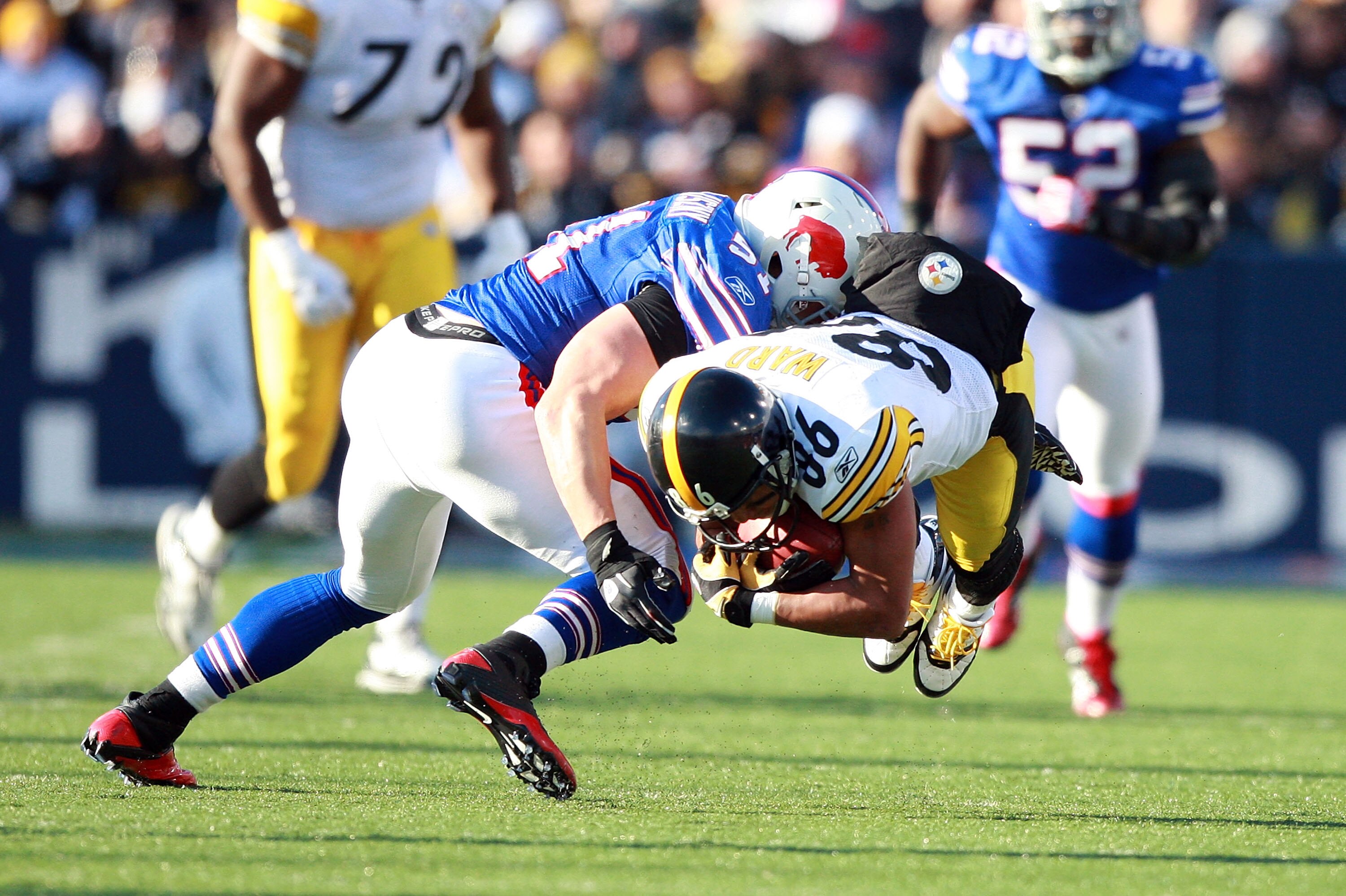 ORCHARD PARK, NY - NOVEMBER 28:  Hines Ward #86 of the Pittsburgh Steelers is tackled by Paul Posluszny #51 of the Buffalo Bills after catching a pass at Ralph Wilson Stadium on November 28, 2010 in Orchard Park, New York.  (Photo by Karl Walter/Getty Ima