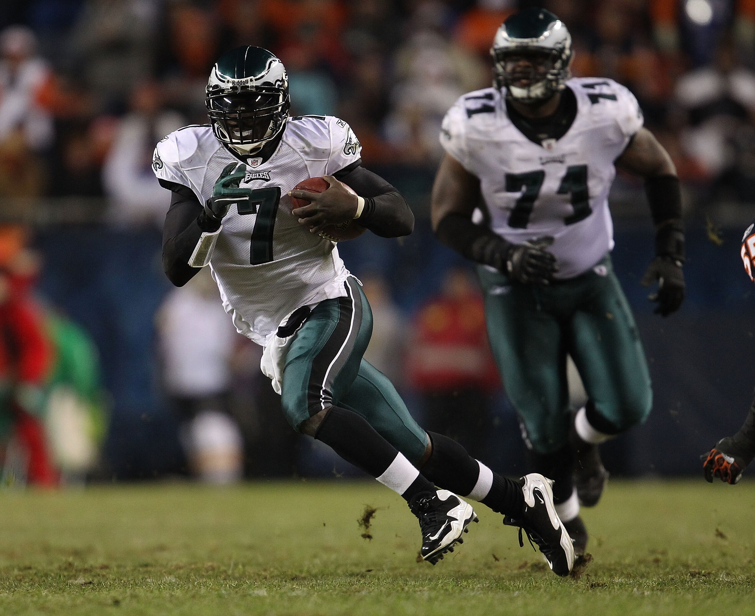 CHICAGO - NOVEMBER 28: Michael Vick #7 of the Philadelphia Eagles runs against the Chicago Bears as teammate Jason Peters #71 trails the play at Soldier Field on November 28, 2010 in Chicago, Illinois. The Bears defeated the Eagles 31-26. (Photo by Jonath CHICAGO - NOVEMBER 28: Michael Vick #7 of the Philadelphia Eagles runs against the Chicago Bears as teammate Jason Peters #71 trails the play at Soldier Field on November 28, 2010 in Chicago, Illinois. The Bears defeated the Eagles 31-26. (Photo by Jonath