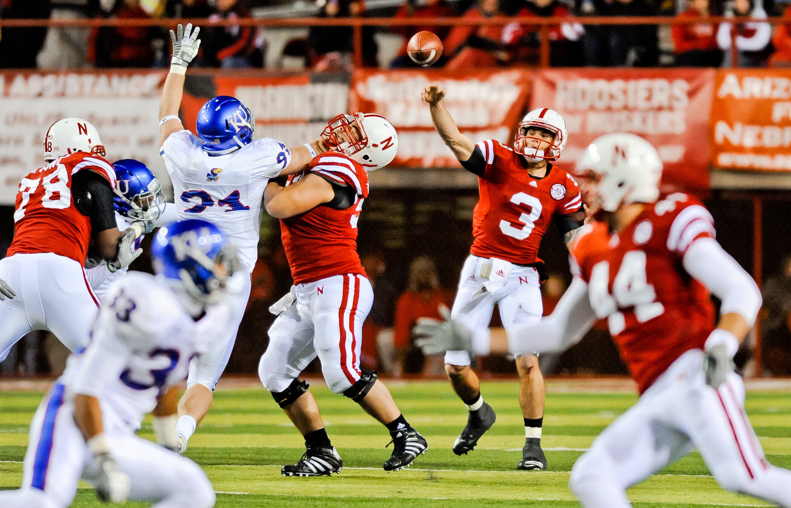 LINCOLN, NE - NOVEMBER 13: Taylor Martinez #3 of the Nebraska Cornhuskers throws downfield against the Kansas Jayhawks during their game at Memorial Stadium on November 13, 2010 in Lincoln, Nebraska. Nebraska Defeated Kansas 20-3. (Photo by Eric Francis/G LINCOLN, NE - NOVEMBER 13: Taylor Martinez #3 of the Nebraska Cornhuskers throws downfield against the Kansas Jayhawks during their game at Memorial Stadium on November 13, 2010 in Lincoln, Nebraska. Nebraska Defeated Kansas 20-3. (Photo by Eric Francis/G