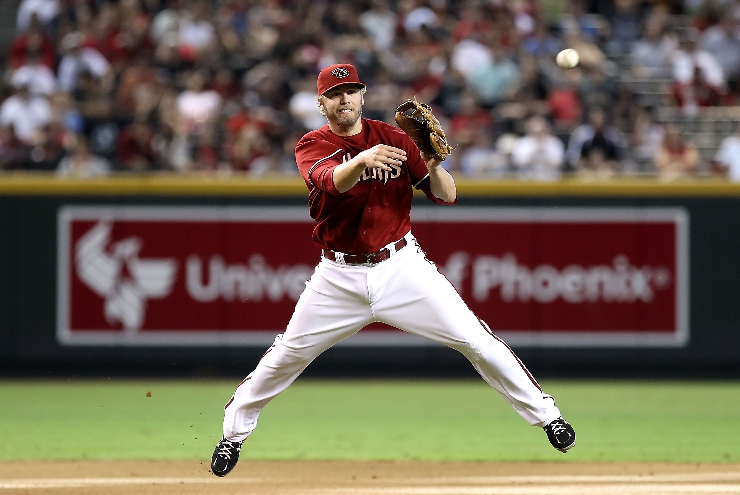 PHOENIX - SEPTEMBER 06:  Infielder Mark Reynolds #27 of the Arizona Diamondbacks fields a ground ball out during the Major League Baseball game against  the San Francisco Giants at Chase Field on September 6, 2010 in Phoenix, Arizona. The Giants defeated