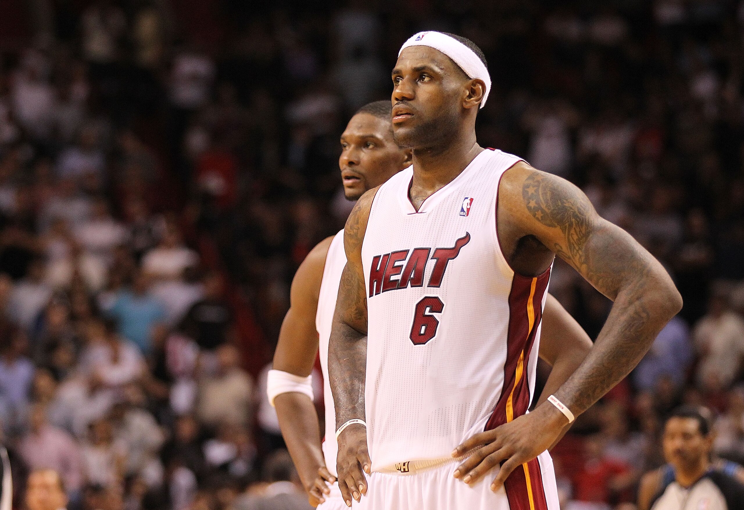 MIAMI, FL - NOVEMBER 29:  LeBron James #6 and Chris Bosh #1 of the Miami Heat look on during a game against the Washington Wizards at American Airlines Arena on November 29, 2010 in Miami, Florida. NOTE TO USER: User expressly acknowledges and agrees that