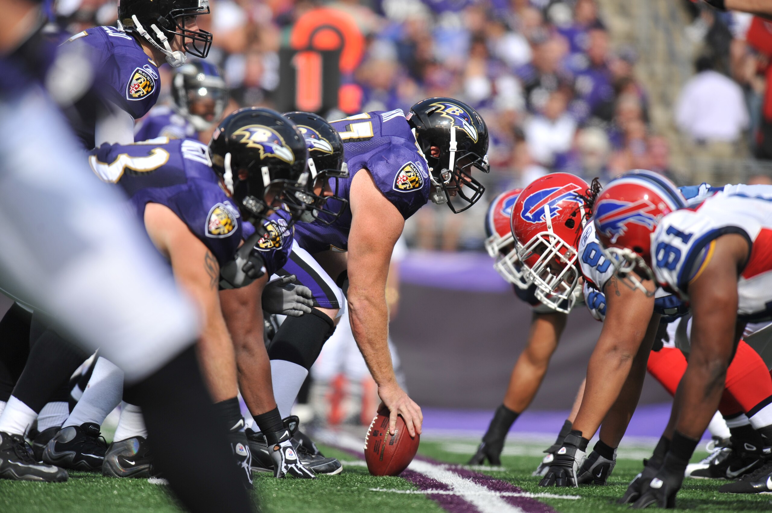 BALTIMORE, MD - OCTOBER 24:  Matt Birk #77 of the Baltimore Ravens snaps the ball against the Buffalo Bills at M&T Bank Stadium on October 24, 2010 in Baltimore, Maryland. The Ravens defeated the Bills 37-34. (Photo by Larry French/Getty Images)