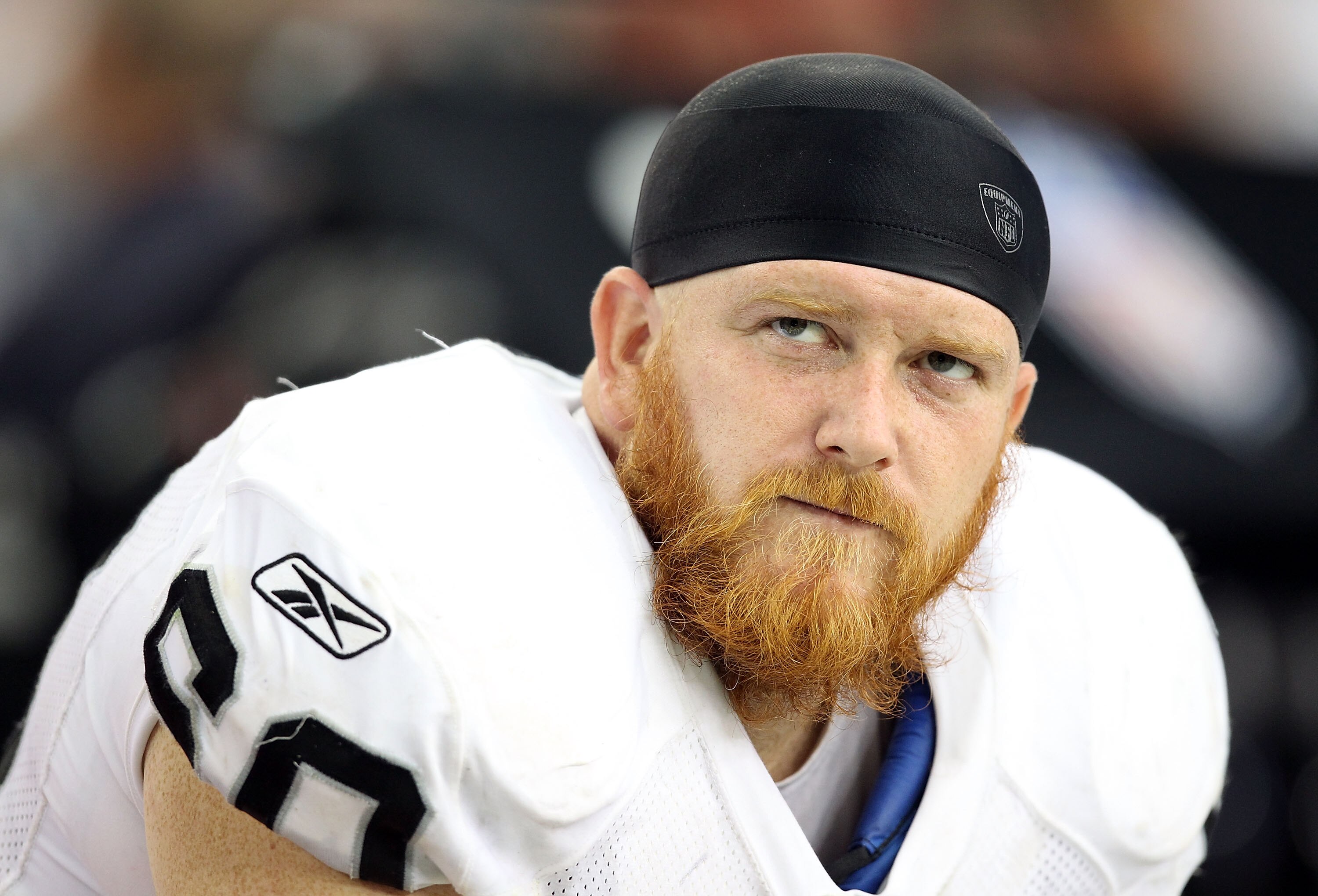 GLENDALE, AZ - SEPTEMBER 26:  Guard Daniel Loper #60 of the Oakland Raiders sits on the sidelines during the NFL game against the Arizona Cardinals at the University of Phoenix Stadium on September 26, 2010 in Glendale, Arizona.  The Cardinals defeated th
