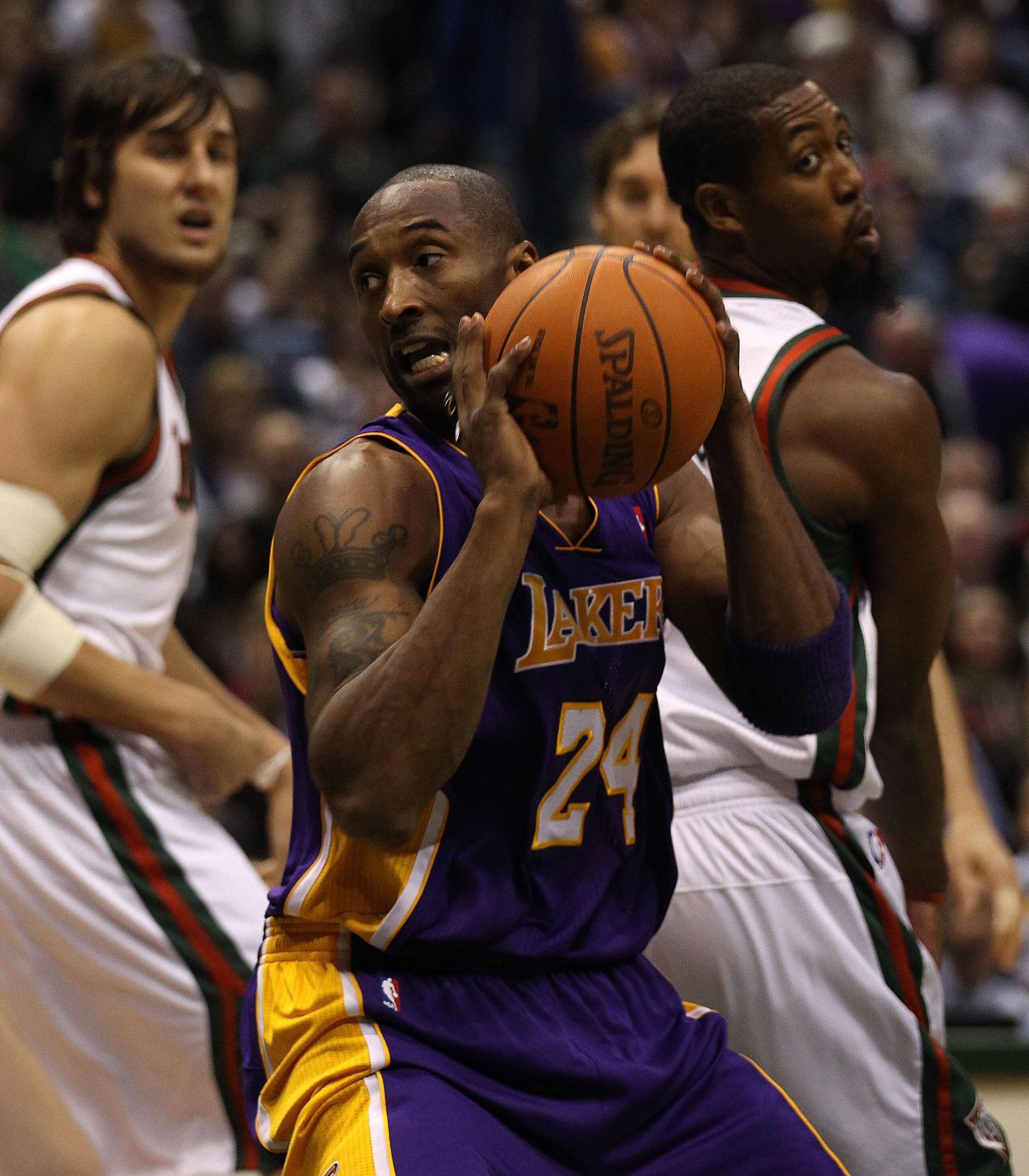 MILWAUKEE - NOVEMBER 16: Kobe Bryant #24 of the Los Angeles Lakers moves to the basket against Andrew Bogut #6 (L) and John Salmons #15 of the Milwaukee Bucks at the Bradley Center on November 16, 2010 in Milwaukee, Wisconsin. NOTE TO USER: User expressly