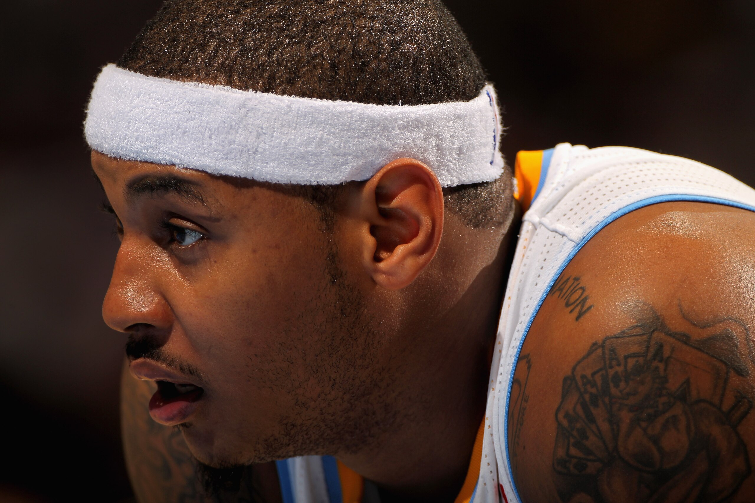 DENVER - NOVEMBER 16:  Carmelo Anthony #15 of the Denver Nuggets looks on during a break in the action against the New York Knicks at the Pepsi Center on November 16, 2010 in Denver, Colorado. The Nuggets defeated the Knicks 120-118. NOTE TO USER: User ex