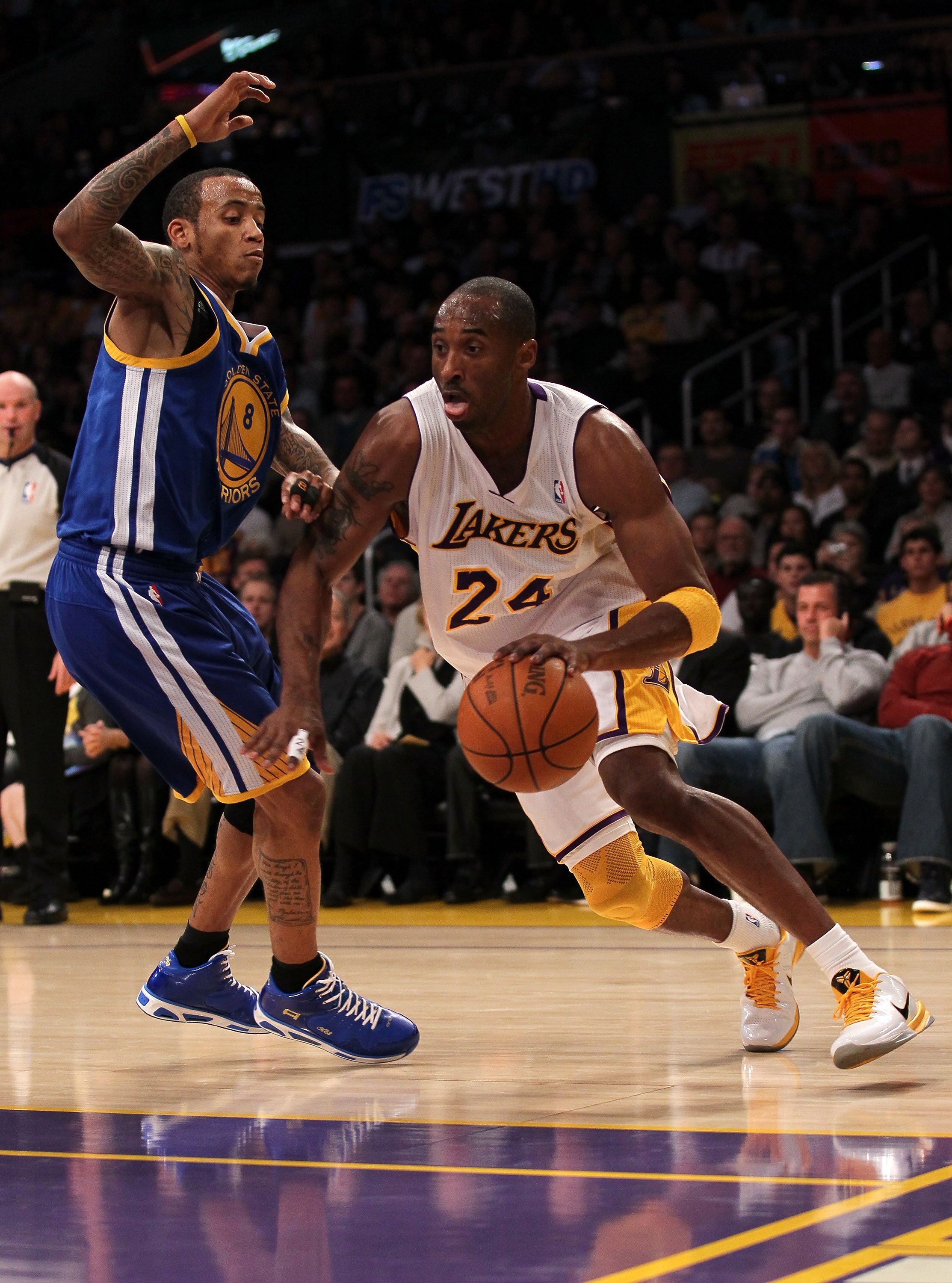 LOS ANGELES, CA - NOVEMBER 21:  Kobe Bryant #24 of the Los Angeles Lakers drives around Monta Ellis #8 of the Golden State Warriors at Staples Center on November 21, 2010 in Los Angeles, California.  The User expressly acknowledges and agrees that, by dow