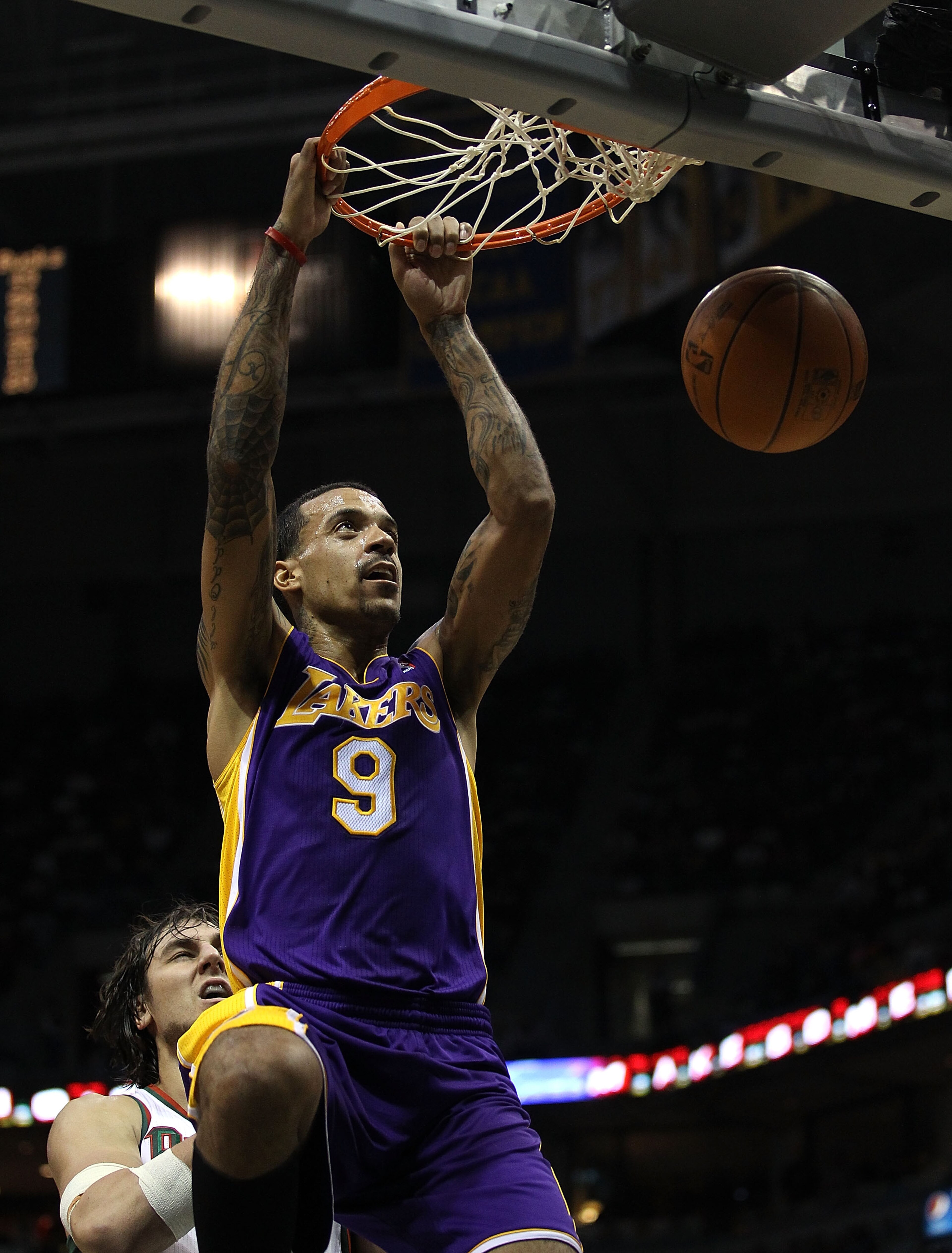 MILWAUKEE - NOVEMBER 16: Matt Barnes #9 of the Los Angeles Lakers dunks the ball over Andrew Bogut #6 of the Milwaukee Bucks at the Bradley Center on November 16, 2010 in Milwaukee, Wisconsin. The Lakers defeated the Bucks 118-107. NOTE TO USER: User expr