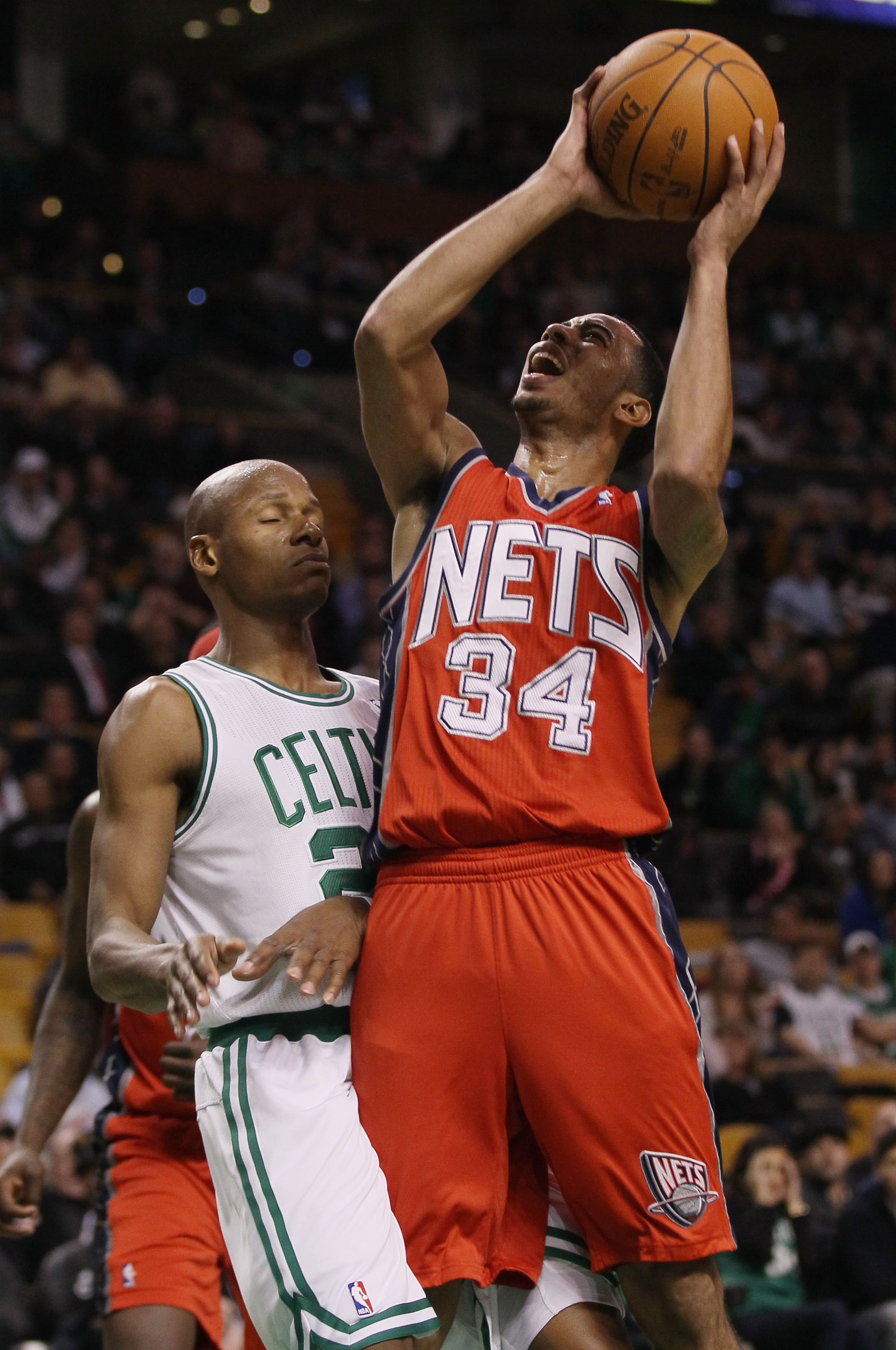 BOSTON - NOVEMBER 24:  Devin Harris #34 of the New Jersey Nets heads for the net as Ray Allen #20 of the Boston Celtics defends on November 24, 2010 at the TD Garden in Boston, Massachusetts. The Celtics defeated the nets 89-83. NOTE TO USER: User express