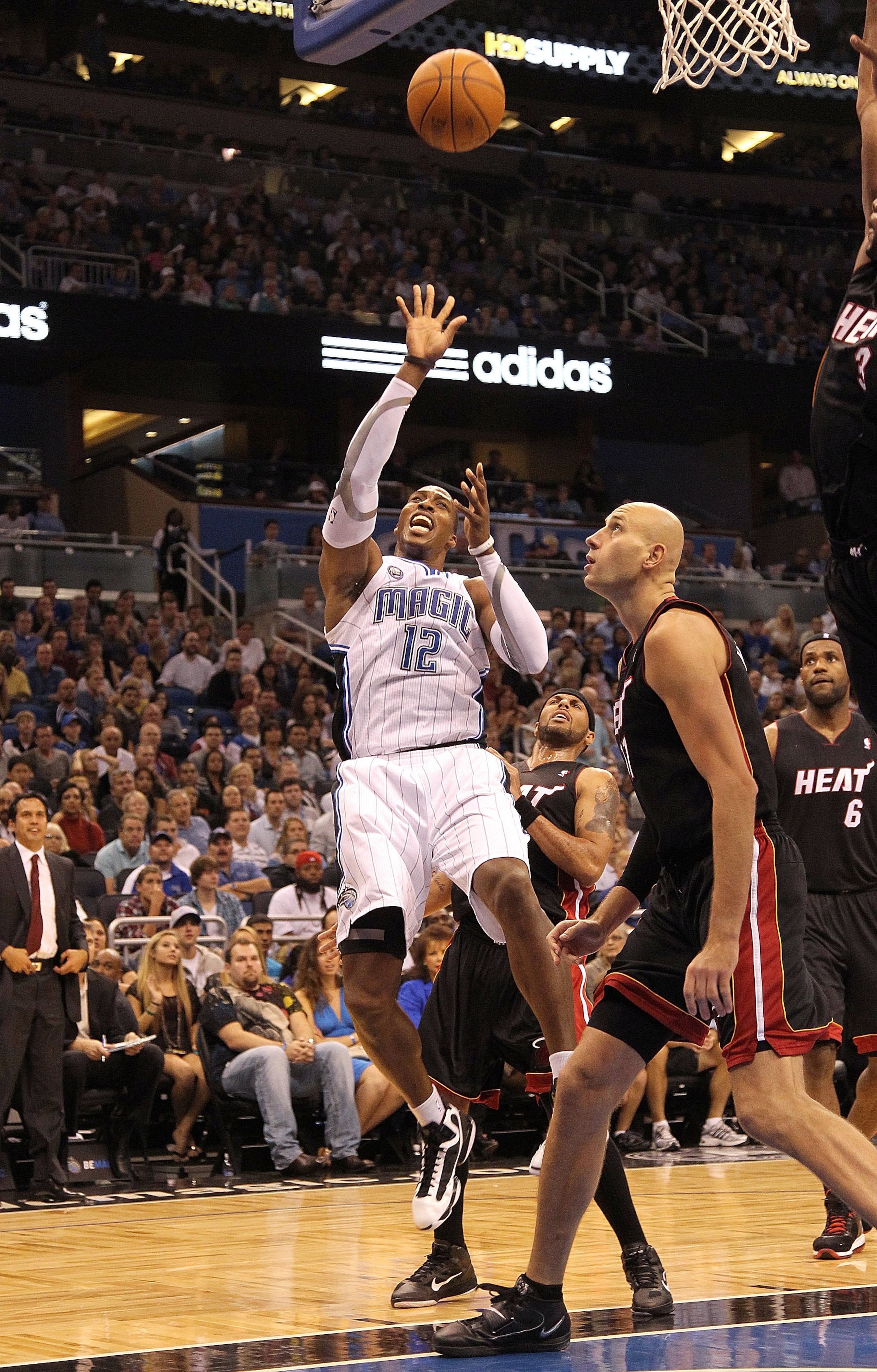 ORLANDO, FL - NOVEMBER 24:  Dwight Howard #12 of the Orlando Magic shoots over Zydrunas Ilgauskas #11 of the Miami Heat during a game at Amway Arena on November 24, 2010 in Orlando, Florida. NOTE TO USER: User expressly acknowledges and agrees that, by do