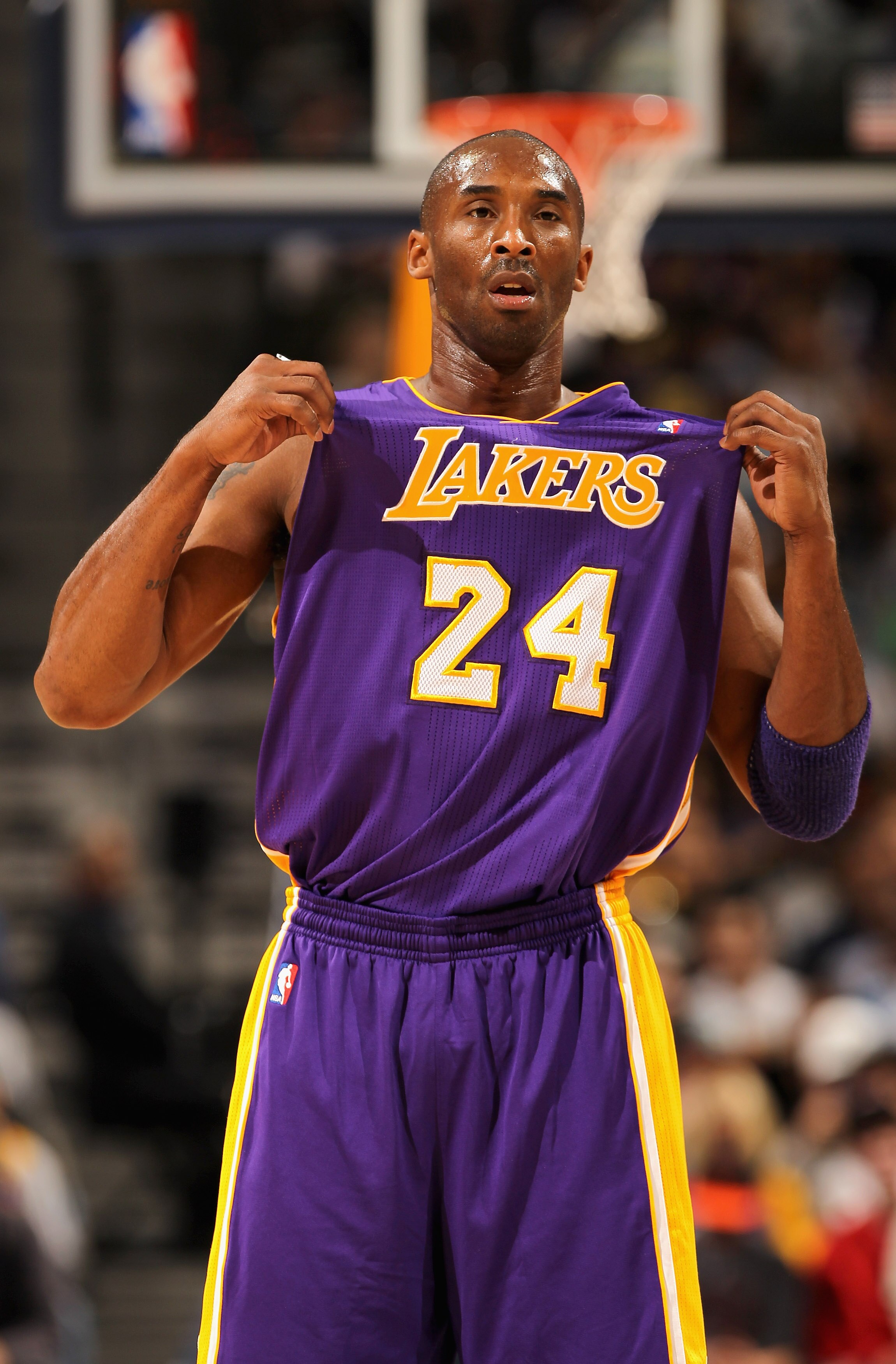 DENVER - NOVEMBER 11:  Kobe Bryant #24 of the Los Angeles Lakers adjusts his jersey as he faces the Denver Nuggets at the Pepsi Center on November 11, 2010 in Denver, Colorado. The Nuggets defeated the Lakers 118-112.  NOTE TO USER: User expressly acknowl