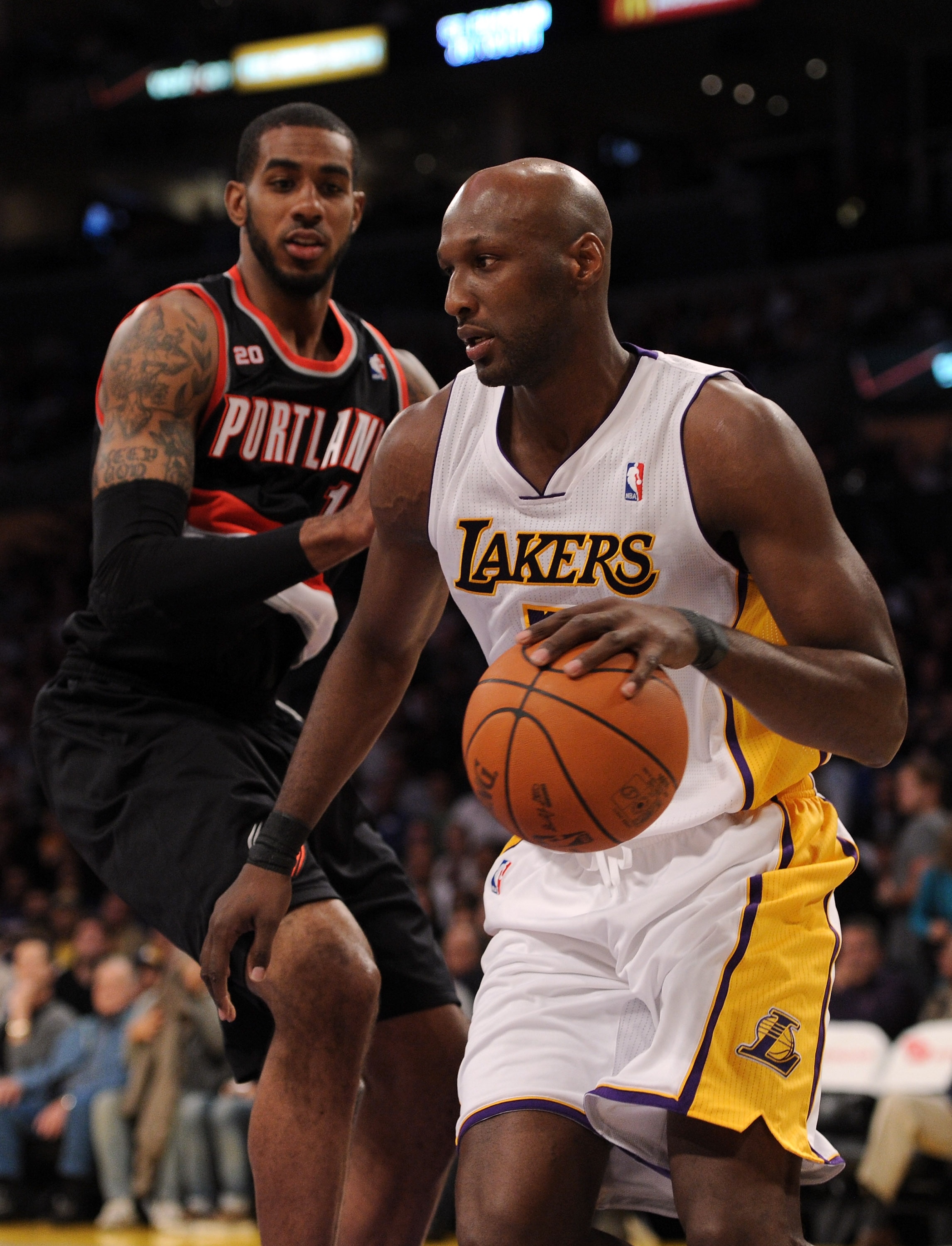 LOS ANGELES, CA - NOVEMBER 07:  Lamar Odum #7 of the Los Angeles Lakers dribbles around LaMarcus Aldridge #12 of the Portland Trail Blazers at the Staples Center on November 7, 2010 in Los Angeles, California.  NOTE TO USER: User expressly acknowledges an