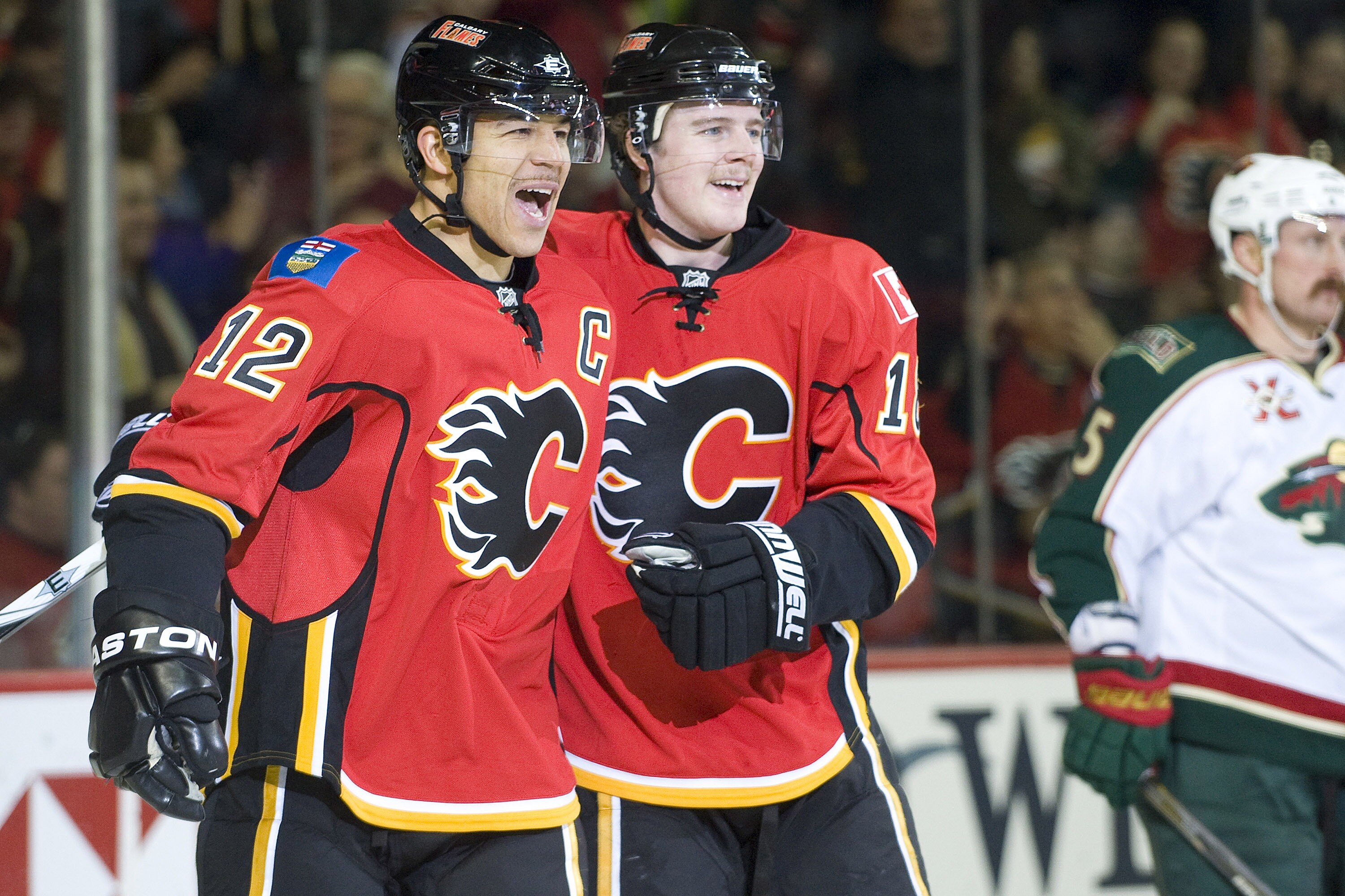 EDMONTON, AB - NOVEMBER 29:  Matt Stajan #18 and Jarome Iginla #12 of the Calgary Flames celebrate a second period goal against the Minnesota Wild at Scotiabank Saddledome on November 29, 2010 in Calgary, Alberta, Canada. (Photo by Dylan Lynch/Getty Image