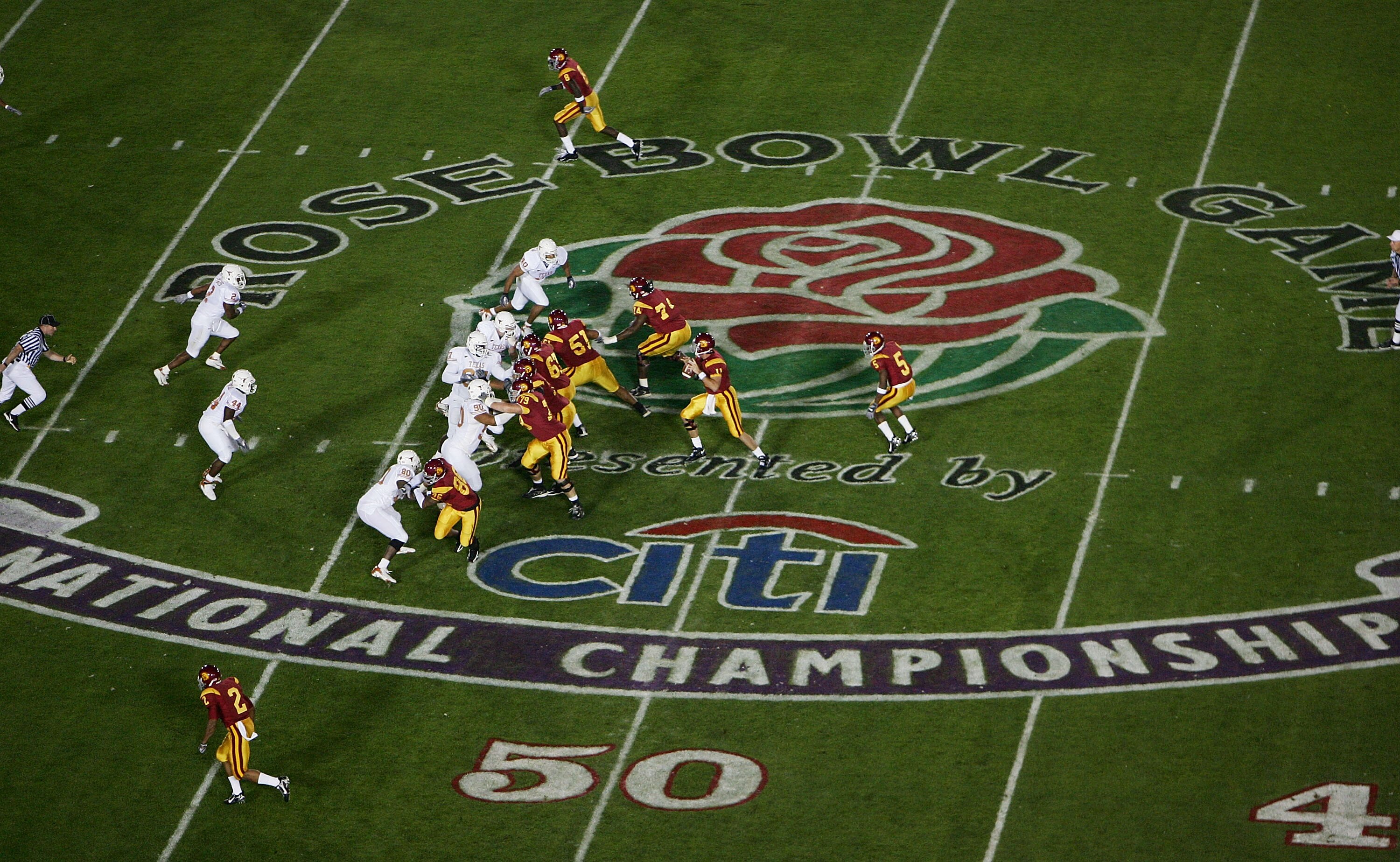 PASADENA, CA - JANUARY 04:  Quarterback Matt Leinart #11 of the USC Trojans drops back to pass against Texas Longhorns defense in the first quarter during the BCS National Championship Rose Bowl Game on January 4, 2006 in Pasadena, California.  (Photo by