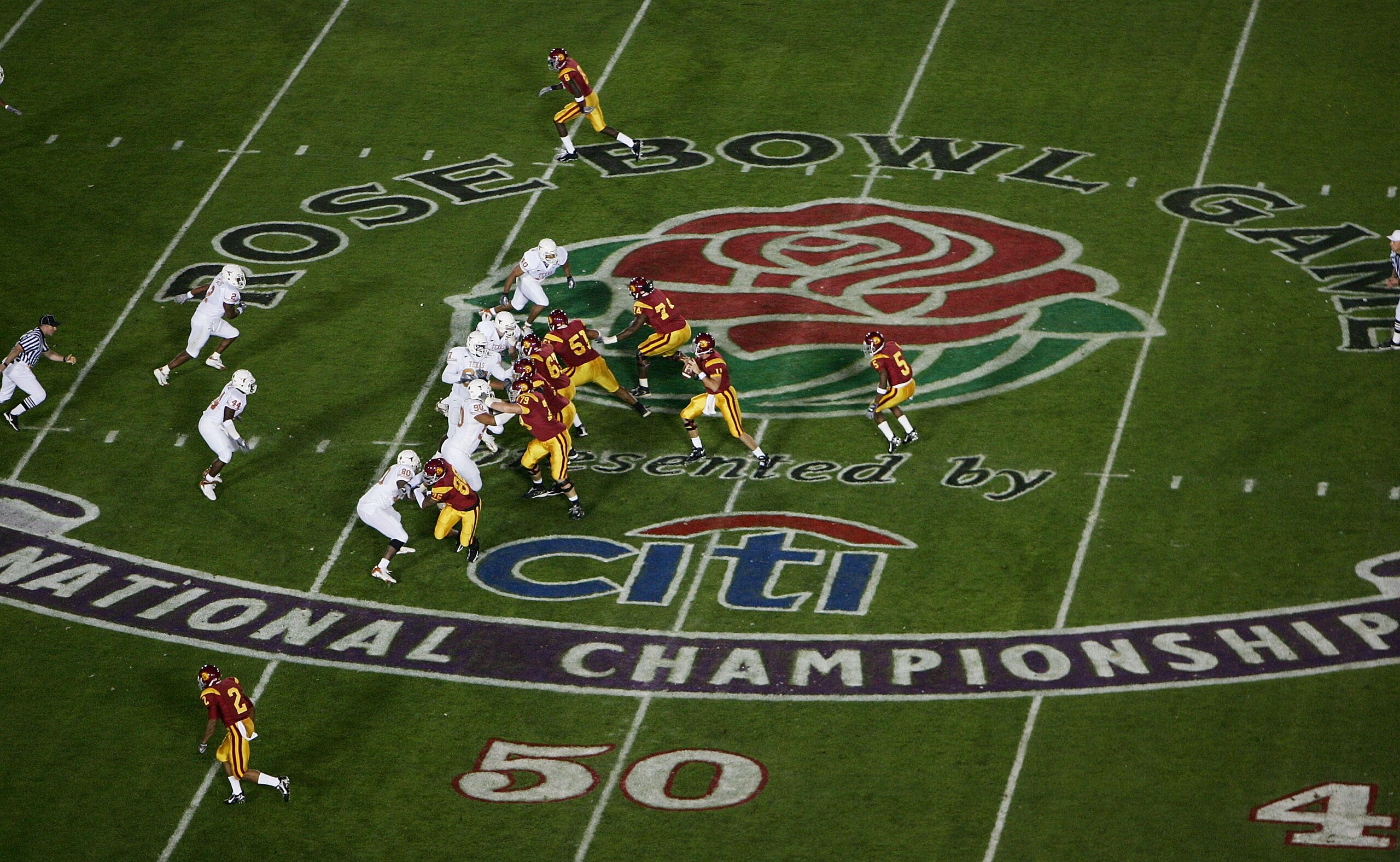 PASADENA, CA - JANUARY 04:  Quarterback Matt Leinart #11 of the USC Trojans drops back to pass against Texas Longhorns defense in the first quarter during the BCS National Championship Rose Bowl Game on January 4, 2006 in Pasadena, California.  (Photo by