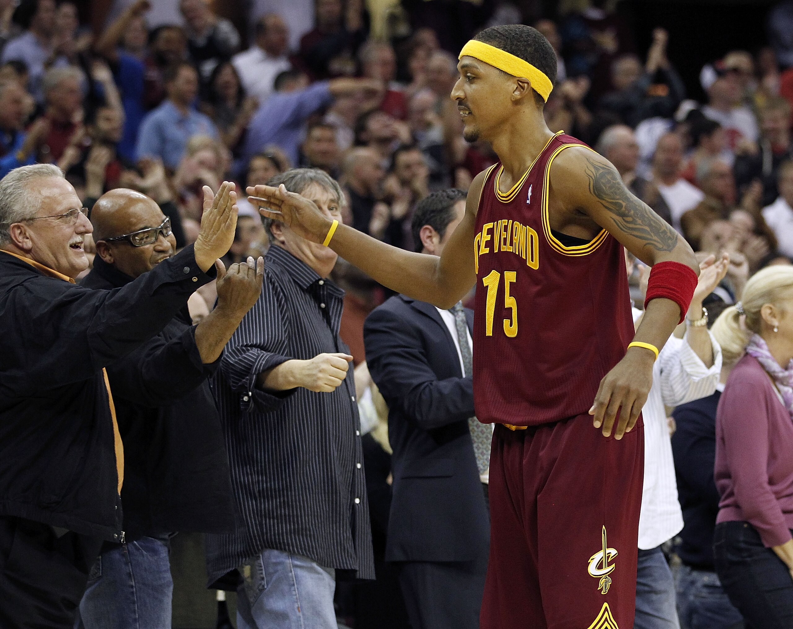 CLEVELAND - OCTOBER 27:  Jamario Moon #15 of the Cleveland Cavaliers high fives fans after beating the Boston Celtics 95-87 at Quicken Loans Arena on October 27, 2010 in Cleveland, Ohio.  (Photo by Gregory Shamus/Getty Images)