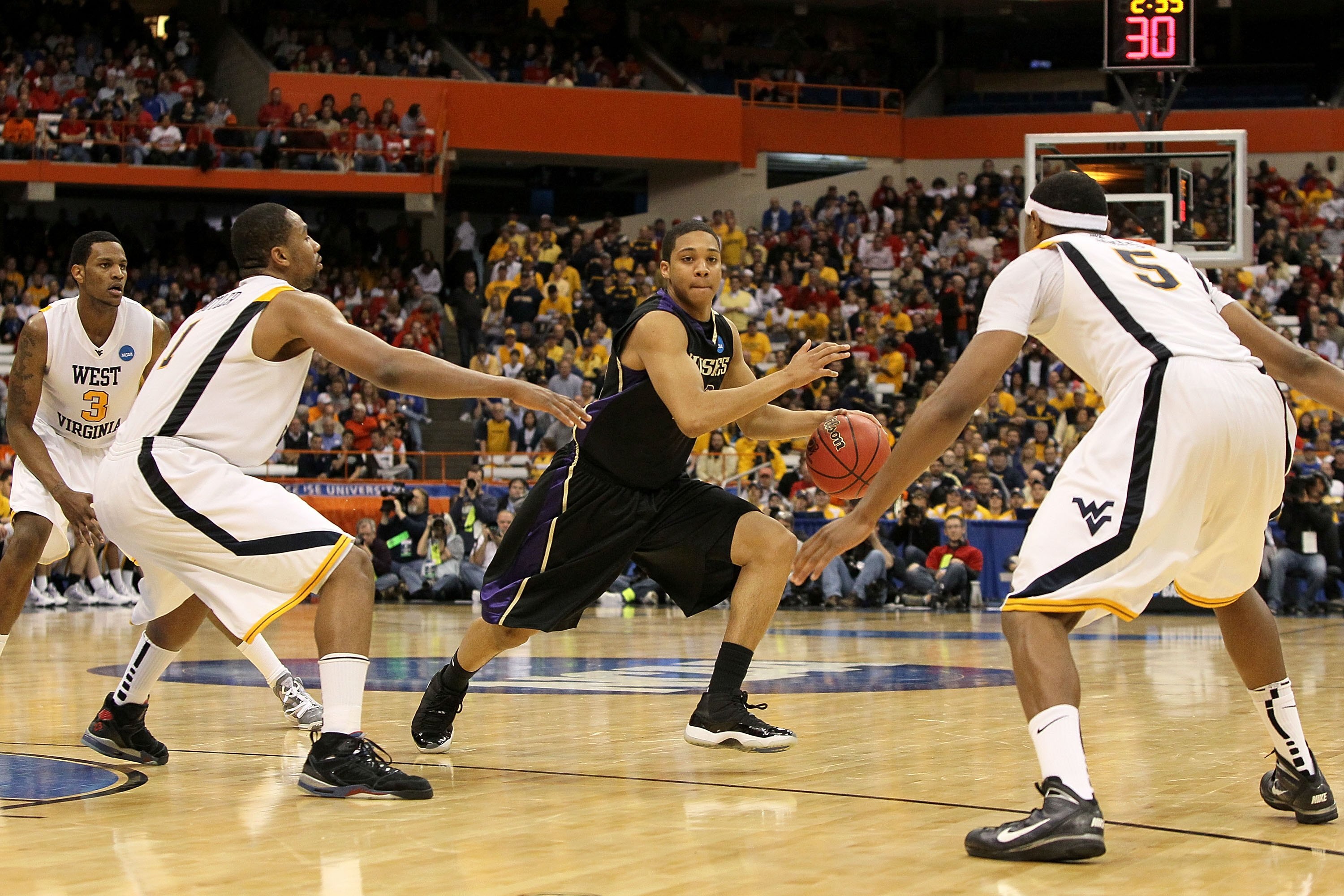 SYRACUSE, NY - MARCH 25:  Abdul Gaddy #10 of the Washington Huskies drives against the West Virginia Mountaineers during the east regional semifinal of the 2010 NCAA men's basketball tournament at the Carrier Dome on March 25, 2010 in Syracuse, New York.