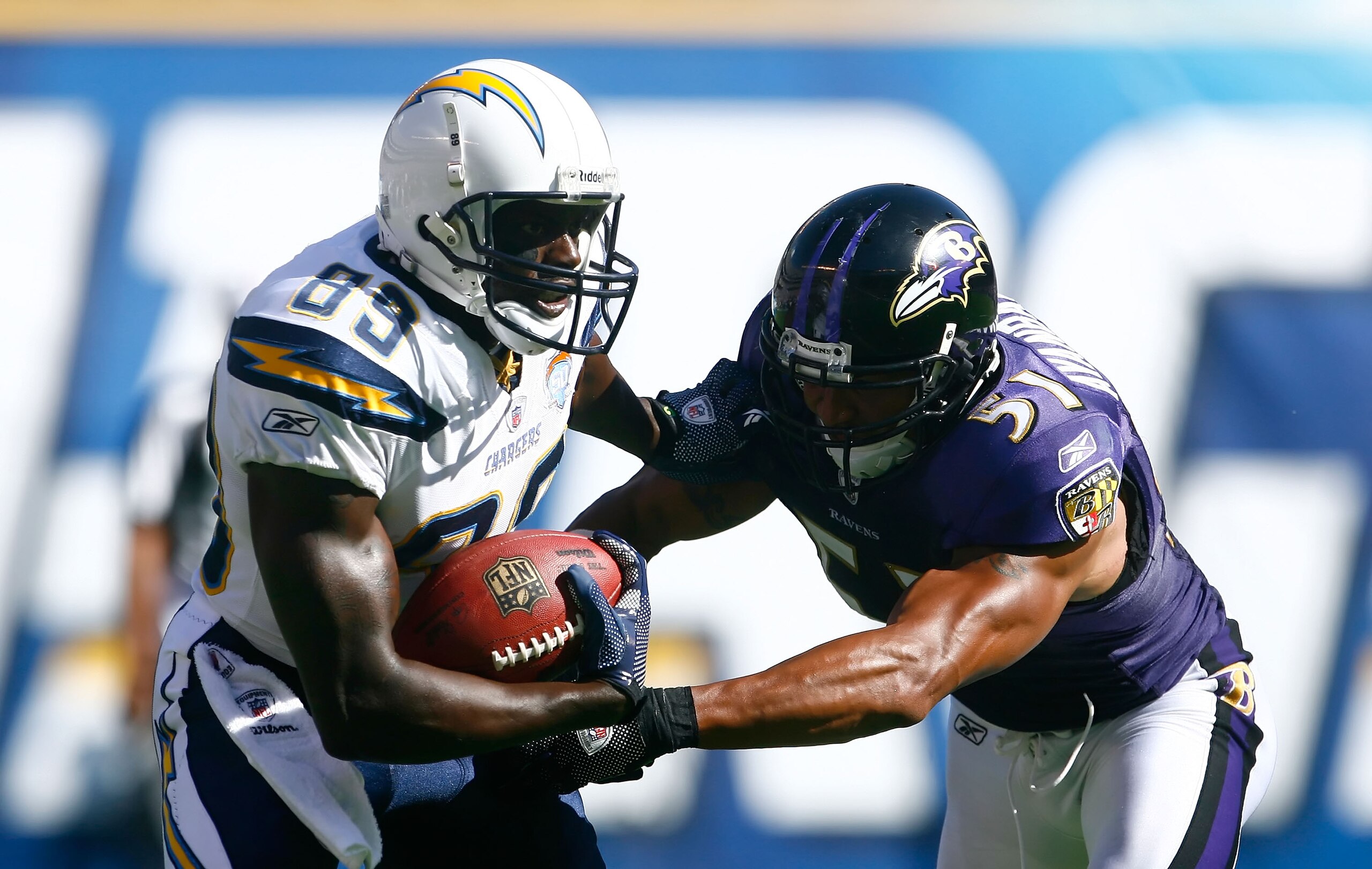 SAN DIEGO , CA - SEPTEMBER 20:  Wide receiver Vincent Jackson #83 of the San Diego Chargers is tackled by Brendon Ayanbadejo #51 of the Baltimore Ravens after a reception in the third quarter at Qualcomm Stadium on September 20, 2009 in San Diego, Califor