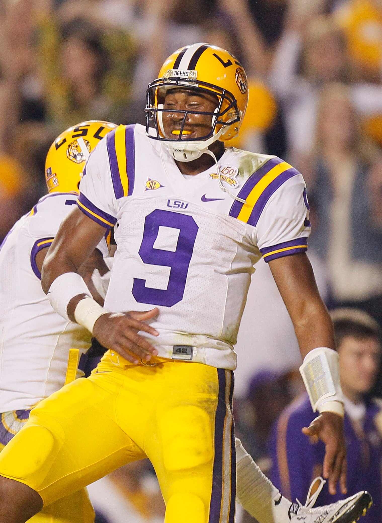 BATON ROUGE, LA - NOVEMBER 20:  Quarterback Jordan Jefferson #9 of the Louisiana State University Tigers reacts after scoring a two-point conversion against the Ole Miss Rebels at Tiger Stadium on November 20, 2010 in Baton Rouge, Louisiana.  (Photo by Ke