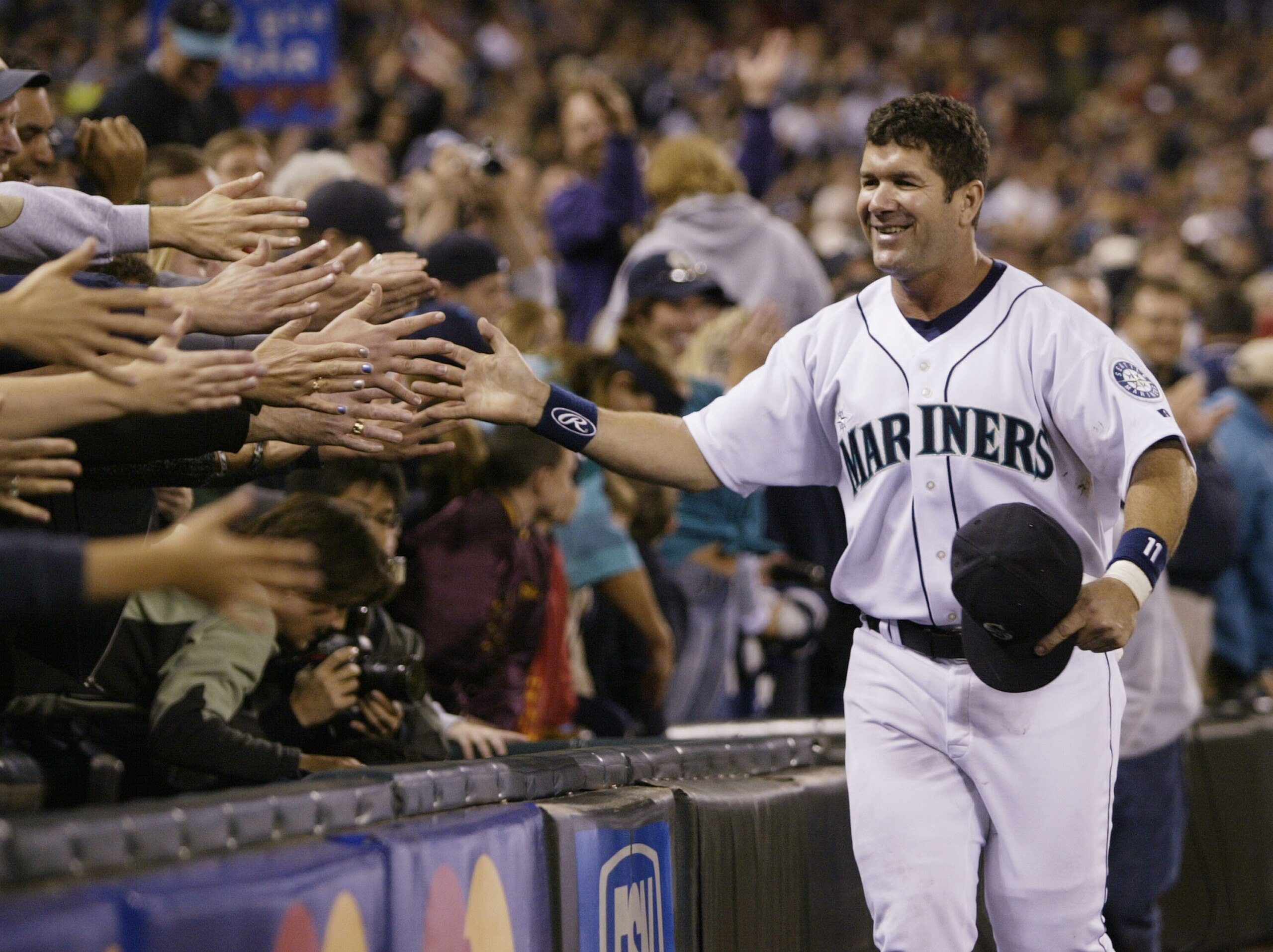 SEATTLE - OCTOBER 2: Edgar Martinez #11 of the Seattle Mariners is greeted by fans as he takes a lap around the field during a post game ceremony honoring his career as a Mariner on October 2 2004 at Safeco Field in Seattle, Washington. (Photo by Otto SEATTLE - OCTOBER 2: Edgar Martinez #11 of the Seattle Mariners is greeted by fans as he takes a lap around the field during a post game ceremony honoring his career as a Mariner on October 2 2004 at Safeco Field in Seattle, Washington. (Photo by Otto