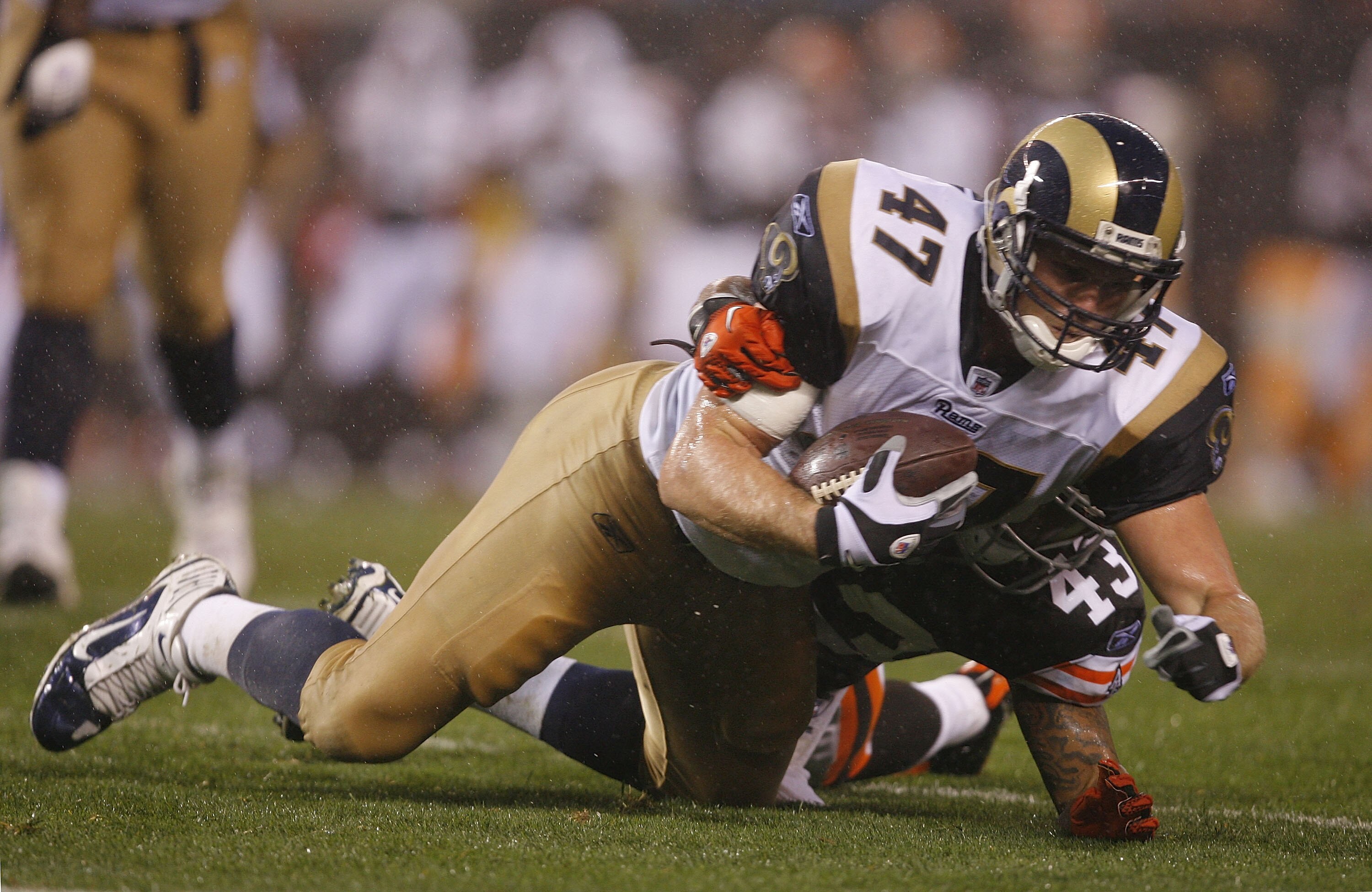 CLEVELAND - AUGUST 21:  Billy Bajema #47 of the St. Louis Rams dives for yardage as he is hit by T.J. Ward #43 of the Cleveland Browns at Cleveland Browns Stadium on August 21, 2010 in Cleveland, Ohio.  (Photo by Matt Sullivan/Getty Images)