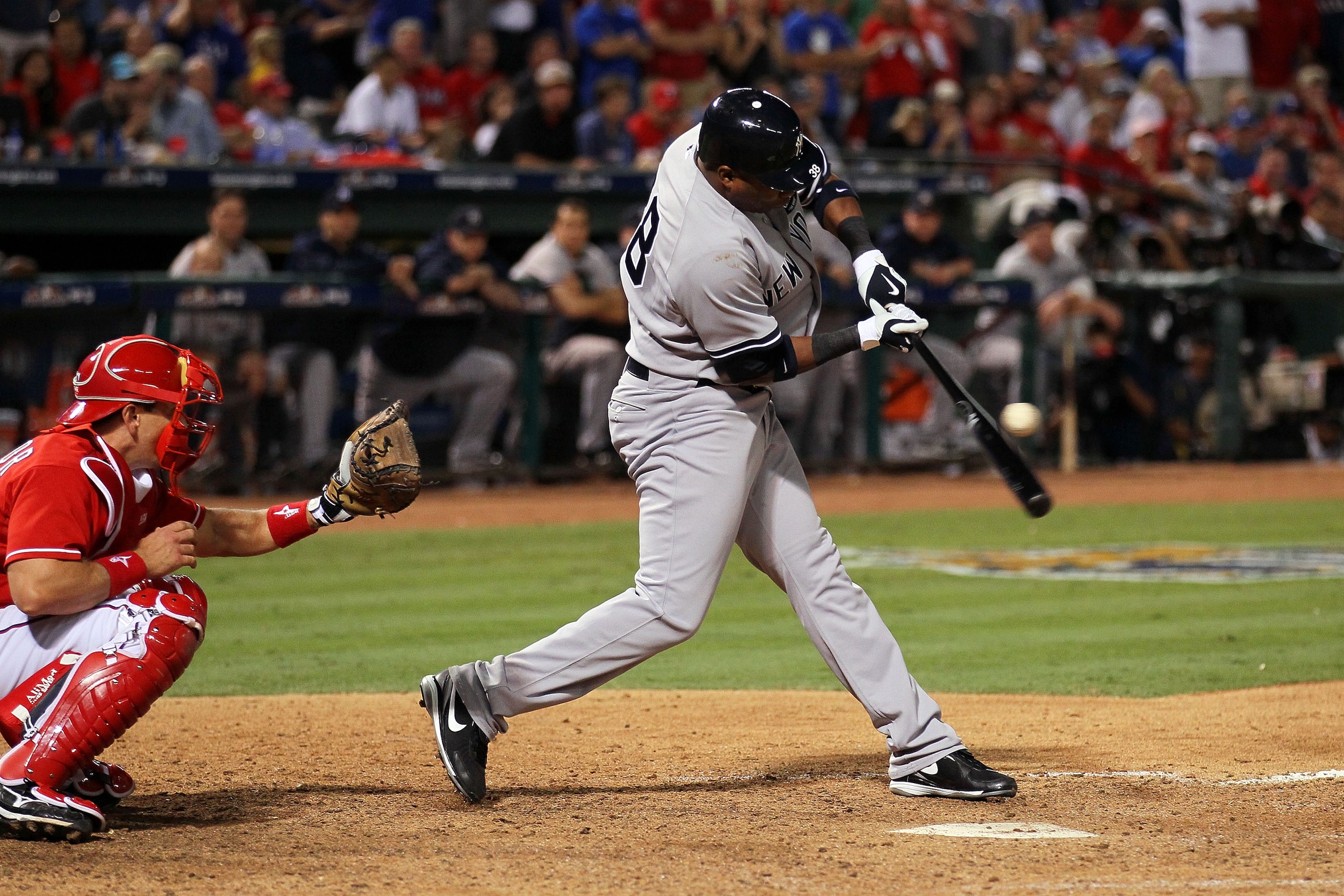 ARLINGTON, TX - OCTOBER 15:  Marcus Thames #38 of the New York Yankees hits a RBI single in the top of the eighth inning against the Texas Rangers in Game One of the ALCS during the 2010 MLB Playoffs at Rangers Ballpark in Arlington on October 15, 2010 in