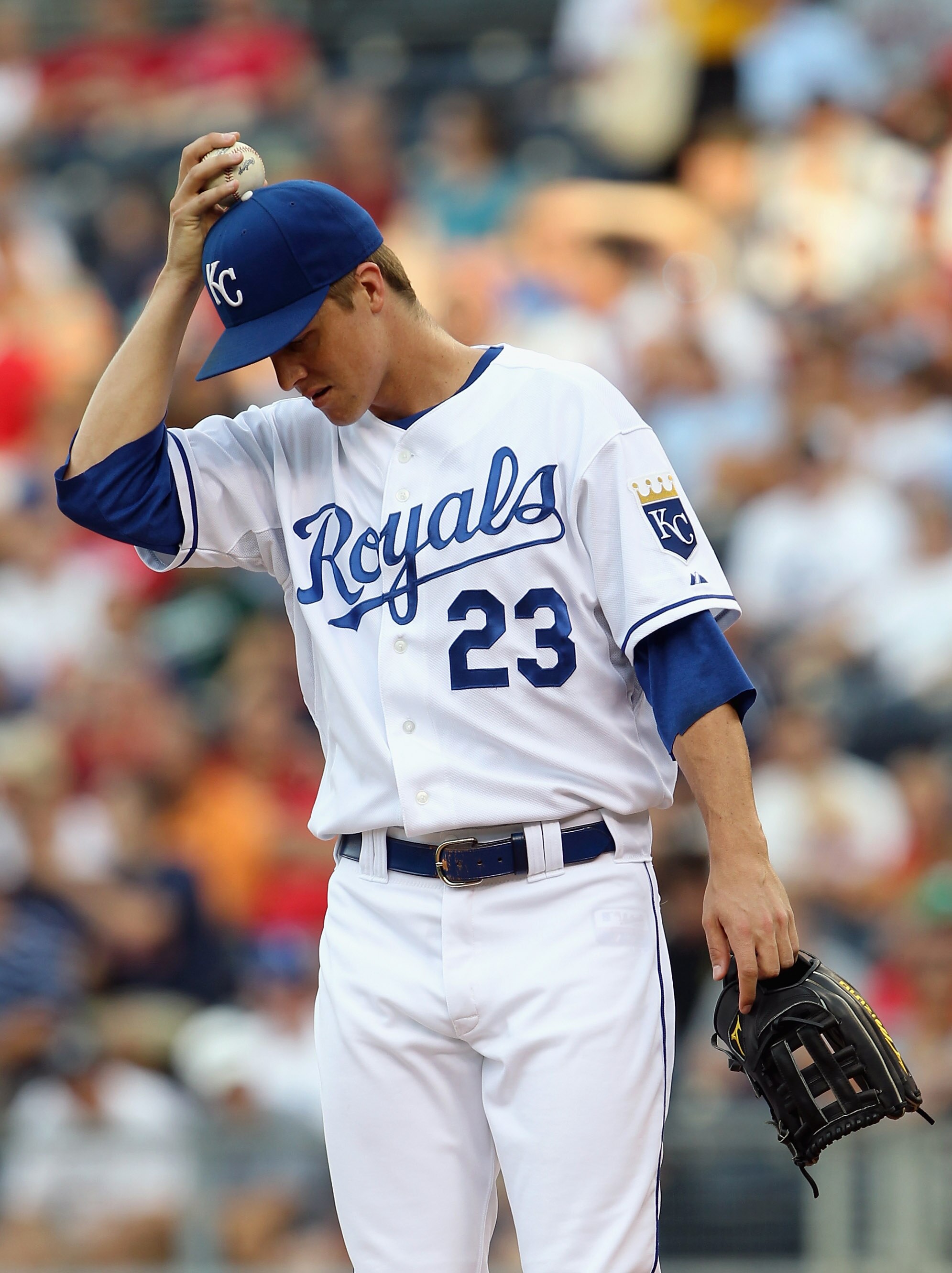 KANSAS CITY, MO - JULY 26:  Starting pitcher Zack Greinke #23 of the Kansas City Royals reacts after giving up a run during the game against the Minnesota Twins on July 26, 2010 at Kauffman Stadium in Kansas City, Missouri.  (Photo by Jamie Squire/Getty I