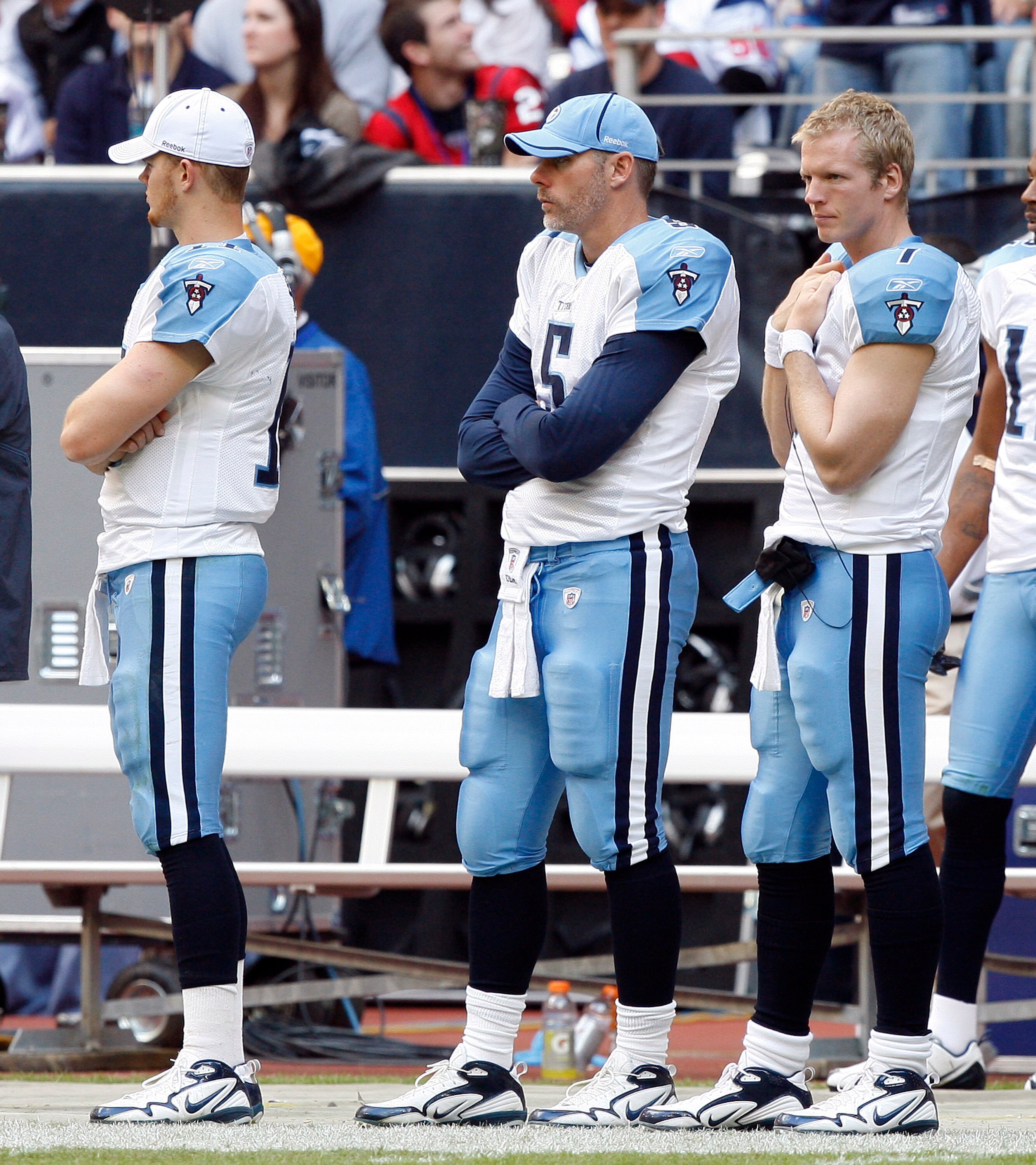 HOUSTON - NOVEMBER 28:  Quarterbacks Rusty Smith, Kerry Collins and Chris Simms, from left, look on from the sidelines in the fourth quarter against the Houston Texans at Reliant Stadium on November 28, 2010 in Houston, Texas.  (Photo by Bob Levey/Getty I