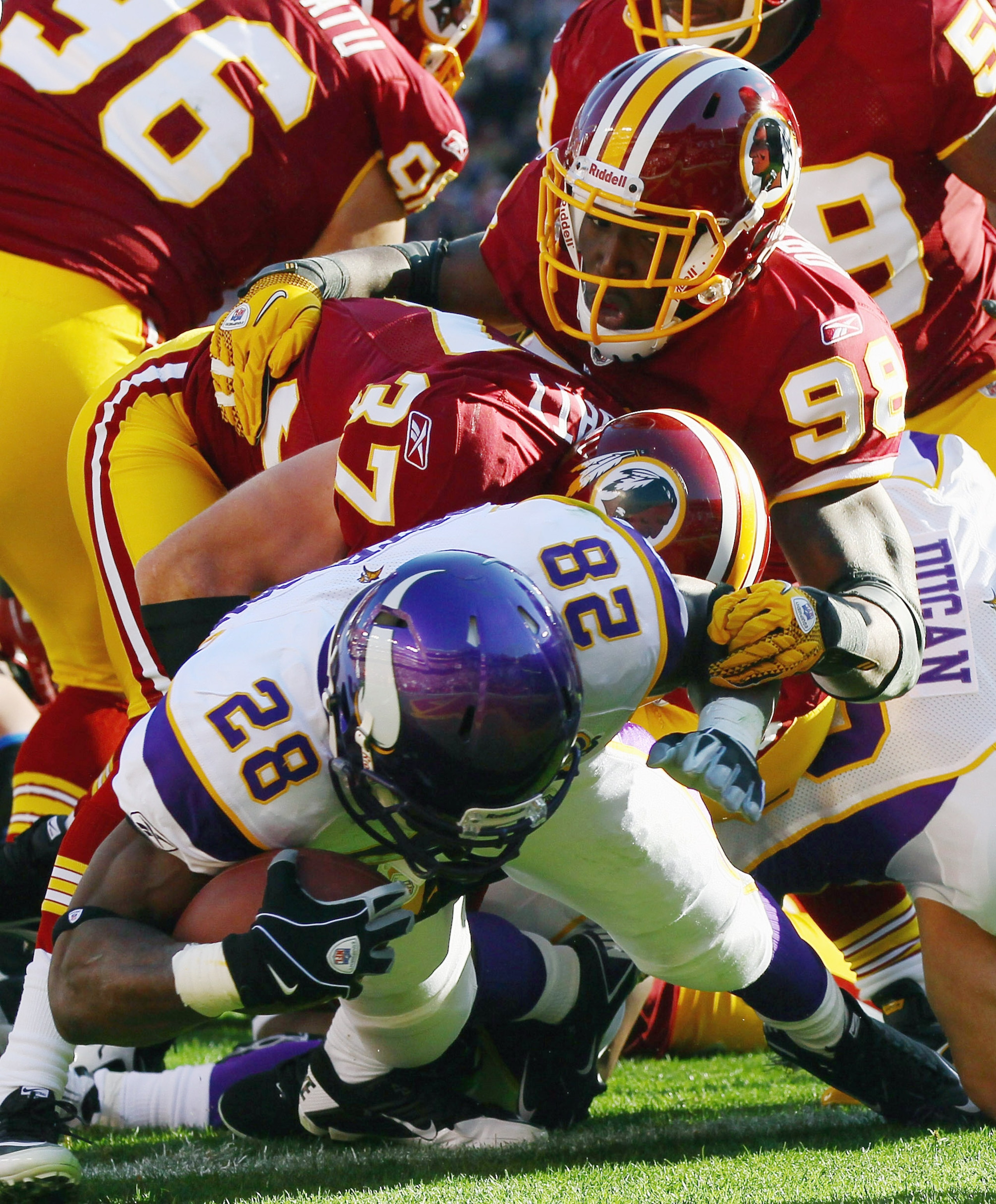 LANDOVER, MD - NOVEMBER 28: Adrian Peterson #28 of the Minnesota Vikings scores a touchdown in the first quarter against the Washington Redskins at FedExField November 28, 2010 in Landover, Maryland. (Photo by Win McNamee/Getty Images)