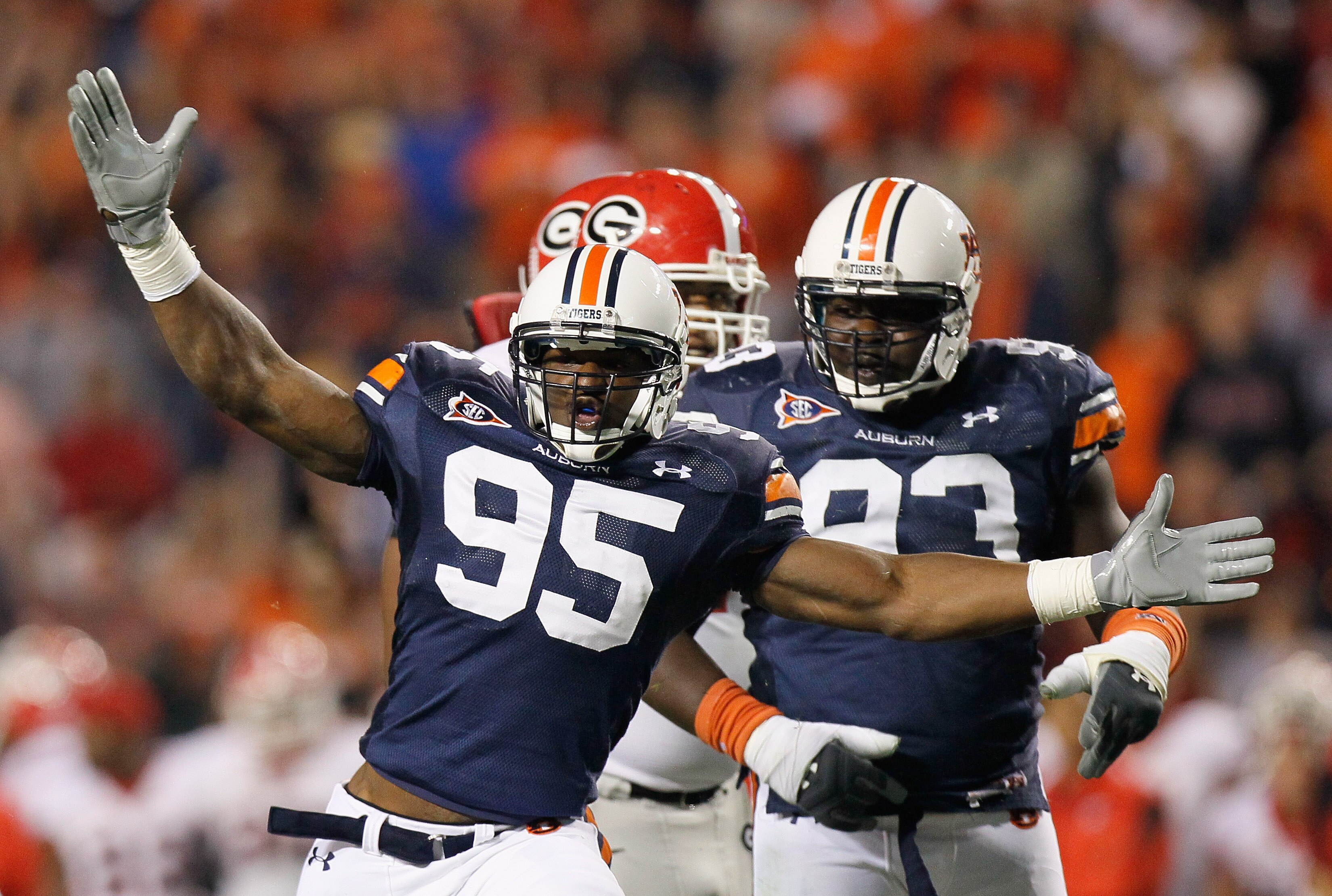 AUBURN, AL - NOVEMBER 13:  Dee Ford #95 of the Auburn Tigers reacts after a defensive stop against the Georgia Bulldogs at Jordan-Hare Stadium on November 13, 2010 in Auburn, Alabama.  (Photo by Kevin C. Cox/Getty Images)