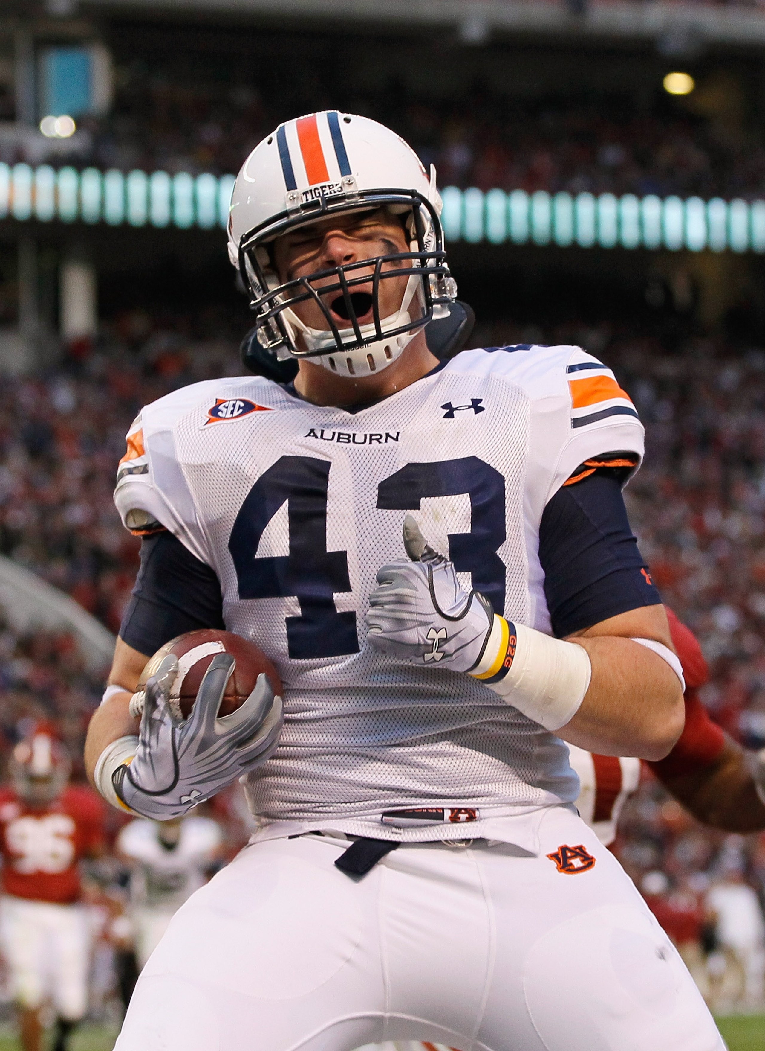TUSCALOOSA, AL - NOVEMBER 26:  Philip Lutzenkirchen #43 of the Auburn Tigers reacts after pulling in a touchdown reception against the Alabama Crimson Tide at Bryant-Denny Stadium on November 26, 2010 in Tuscaloosa, Alabama.  (Photo by Kevin C. Cox/Getty