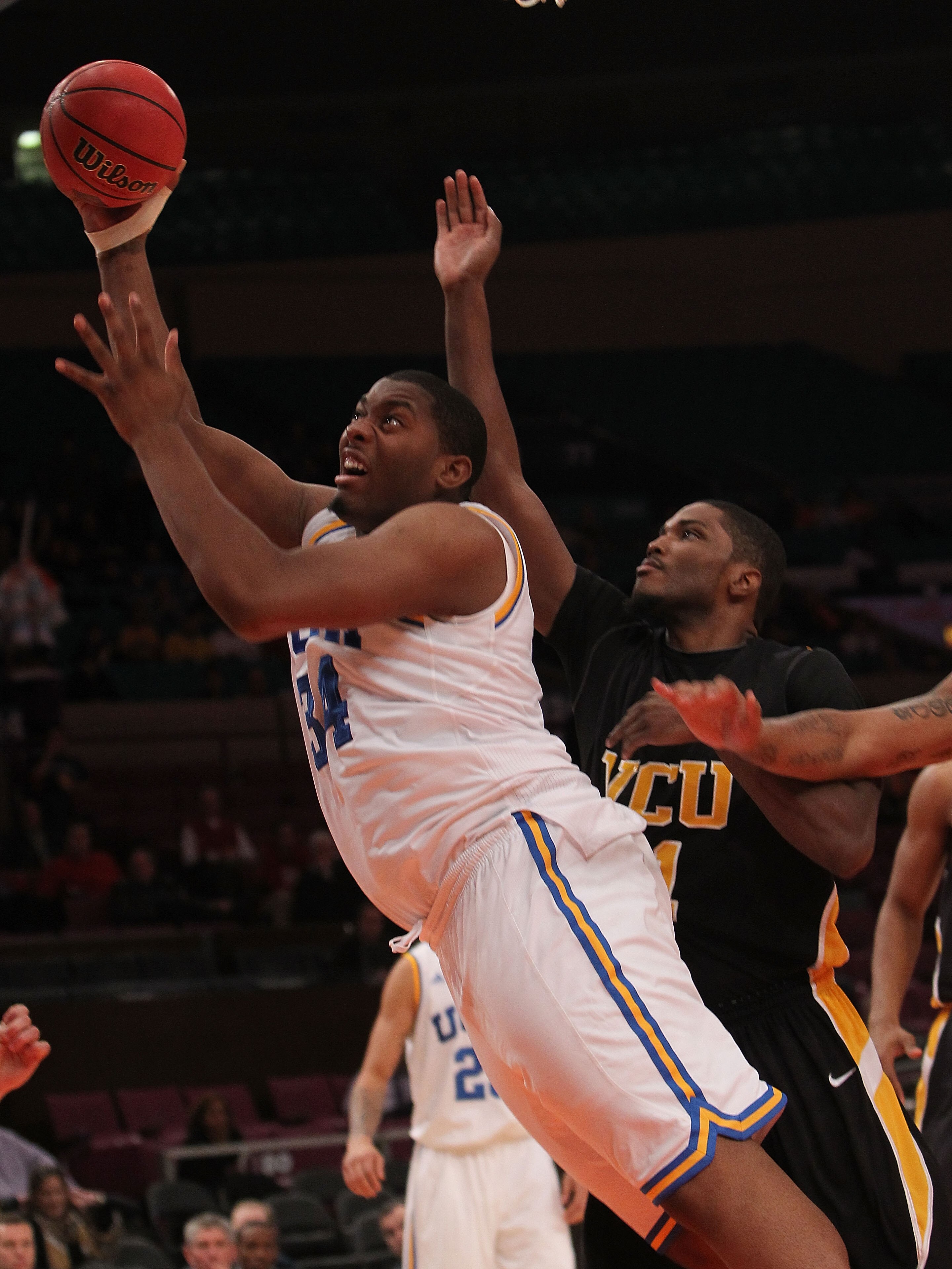 NEW YORK - NOVEMBER 26: Joshua Smith #34 of the UCLA Bruins shoots against the Virginia Commonwealth Rams during their consolation game at Madison Square Garden on November 26, 2010 in New York City.  (Photo by Nick Laham/Getty Images)