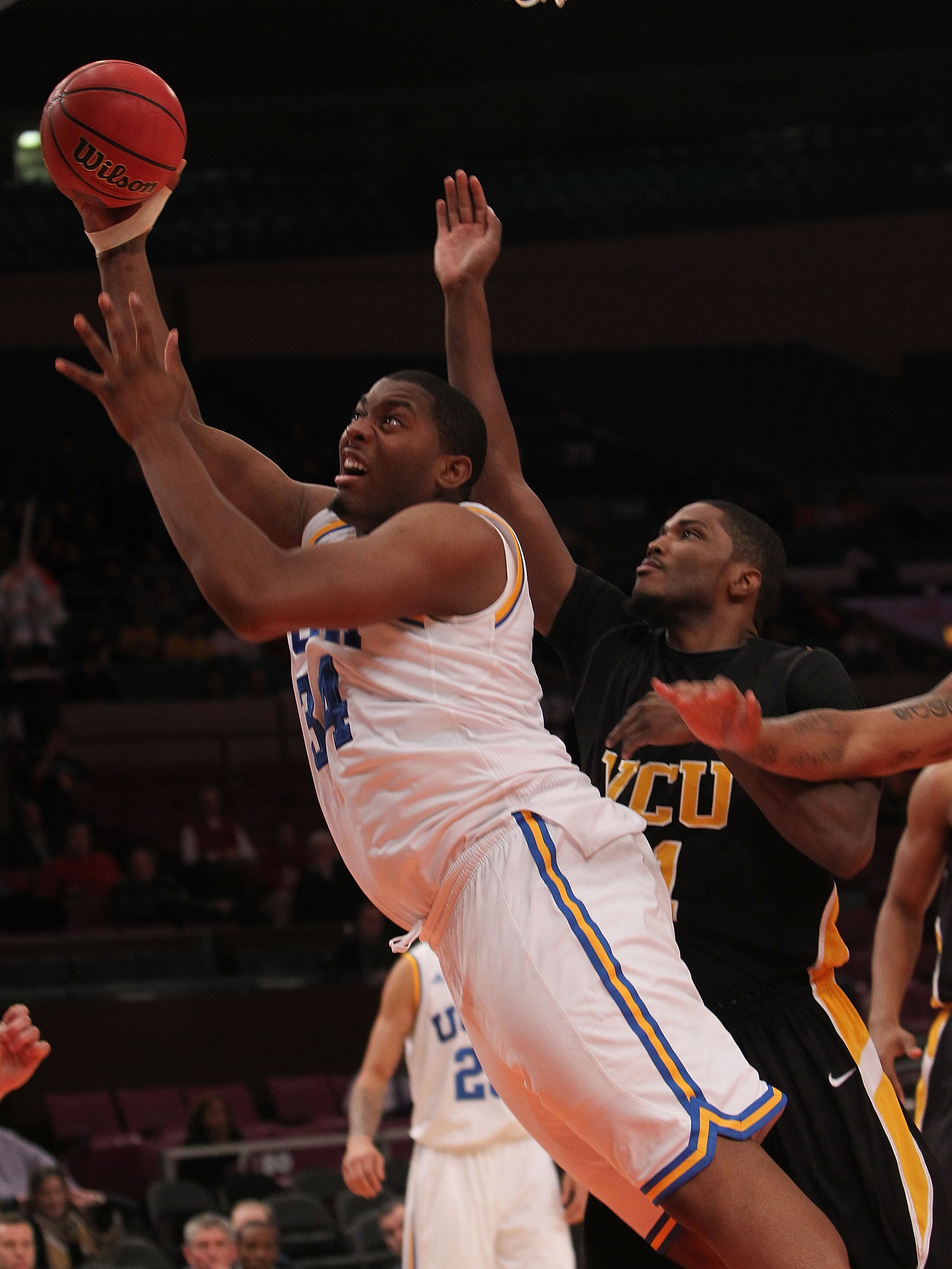NEW YORK - NOVEMBER 26: Joshua Smith #34 of the UCLA Bruins shoots against the Virginia Commonwealth Rams during their consolation game at Madison Square Garden on November 26, 2010 in New York City.  (Photo by Nick Laham/Getty Images)
