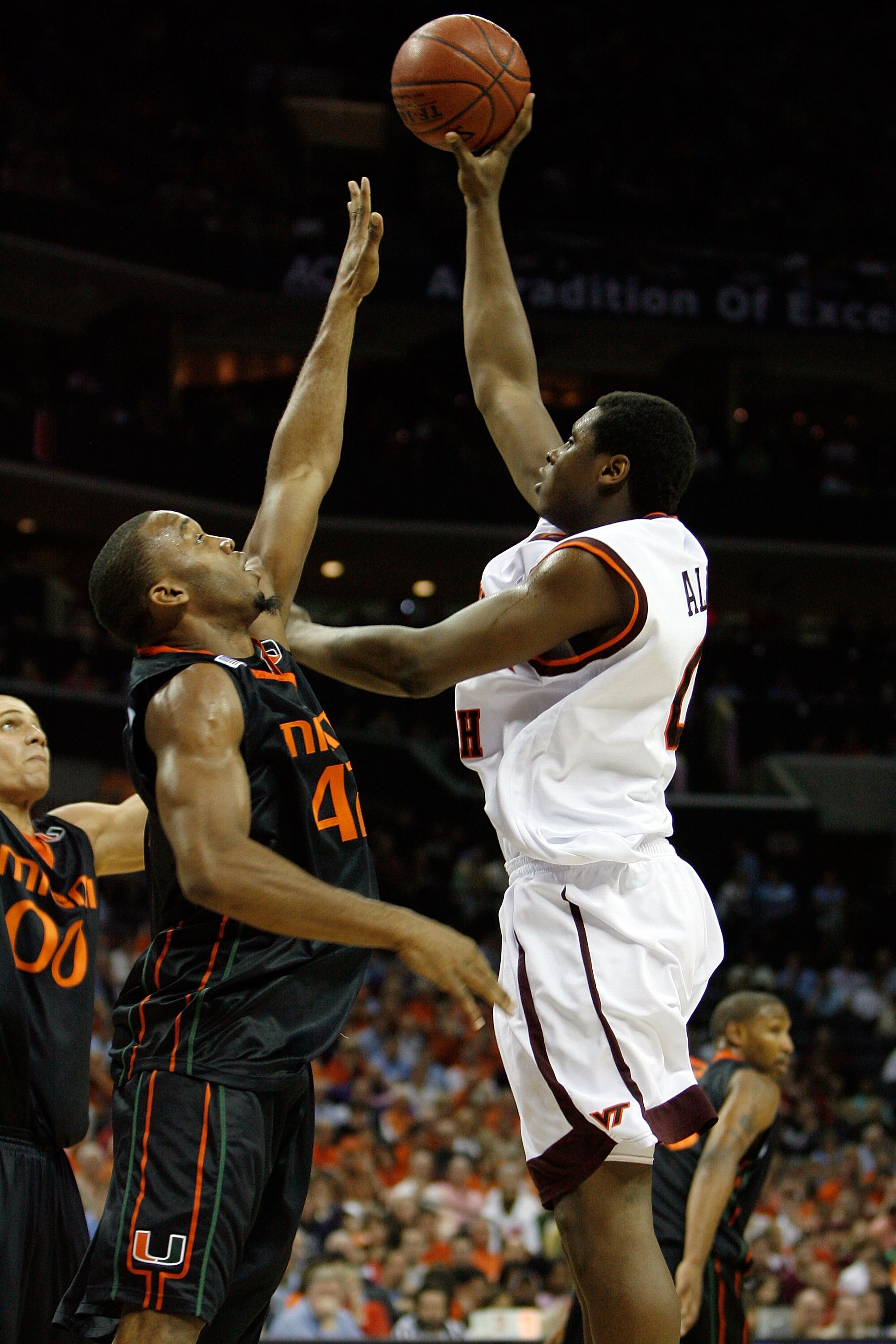 CHARLOTTE, NC - MARCH 14:  Jeff Allen #0 of the Virginia Tech Hokies goes up for a shot in the lane against Raymond Hicks #42 of the Miami Hurricanes during day two of the 2008 Men's ACC Basketball Tournament at Bobcats Arena on March 14, 2008 in Charlott